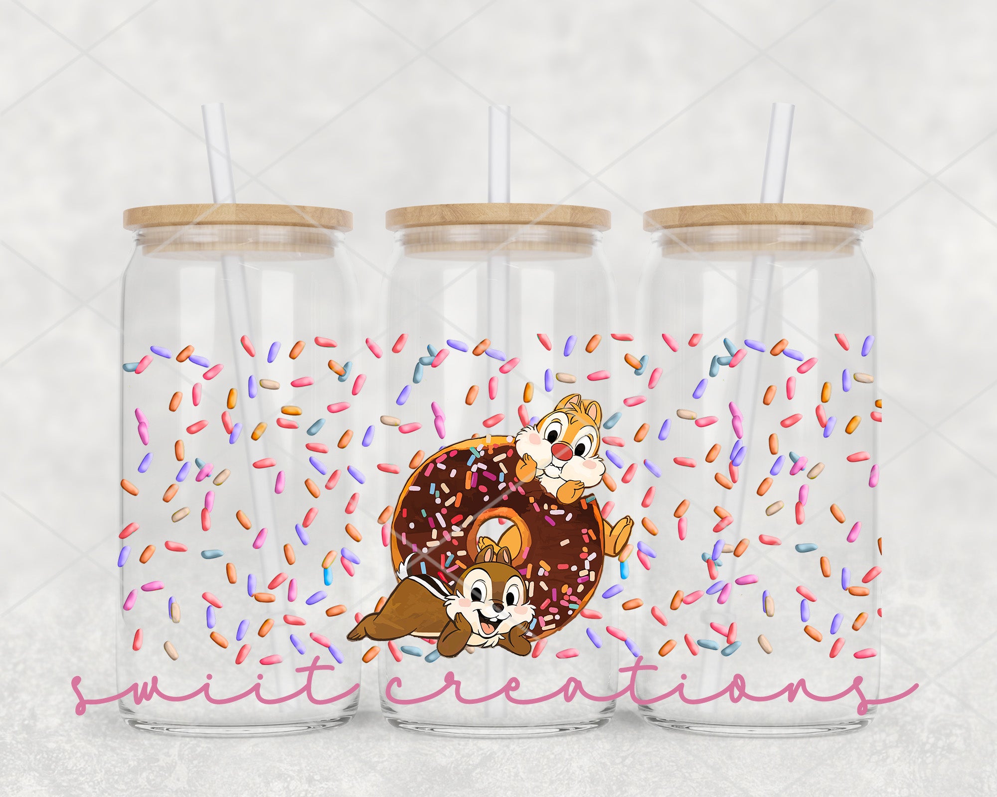 a couple of glass jars filled with donuts and sprinkles