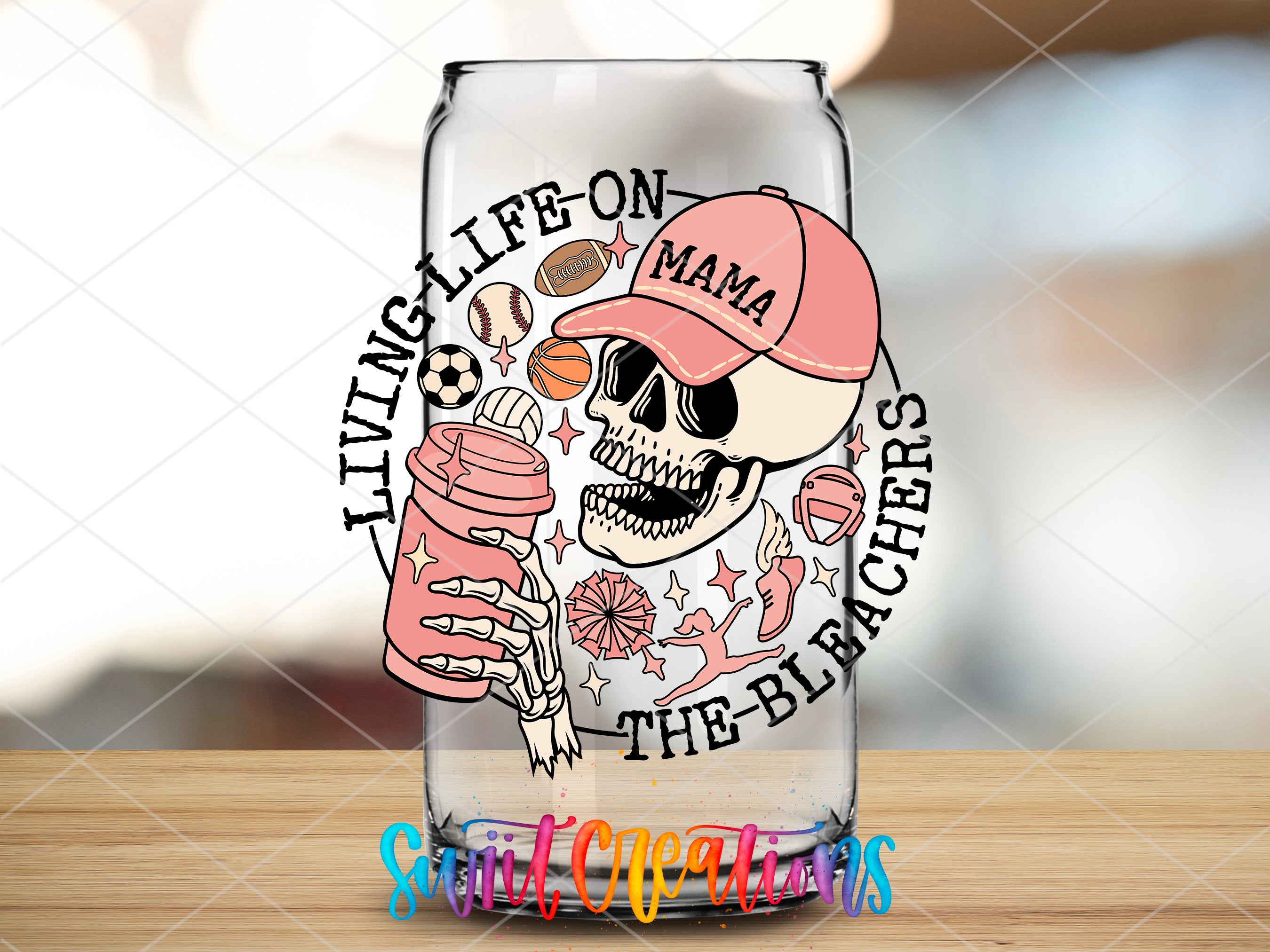 a glass with a skull and a baseball cap on it