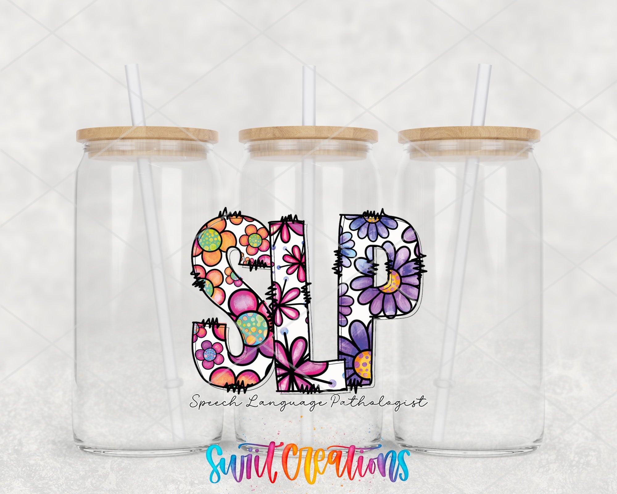 two clear tumblers with floral designs on them