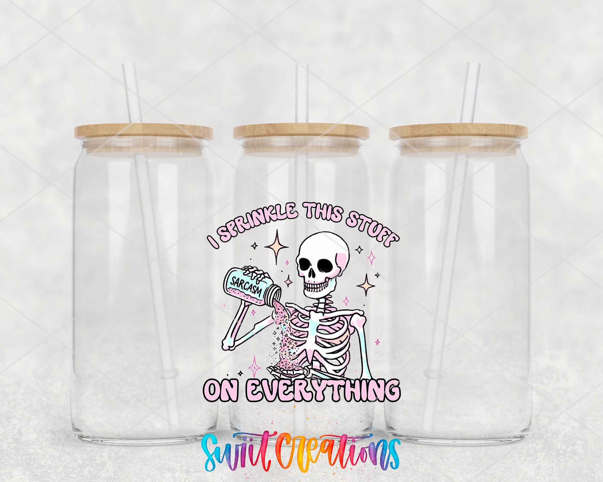 two clear tumblers with a skeleton holding a toothbrush