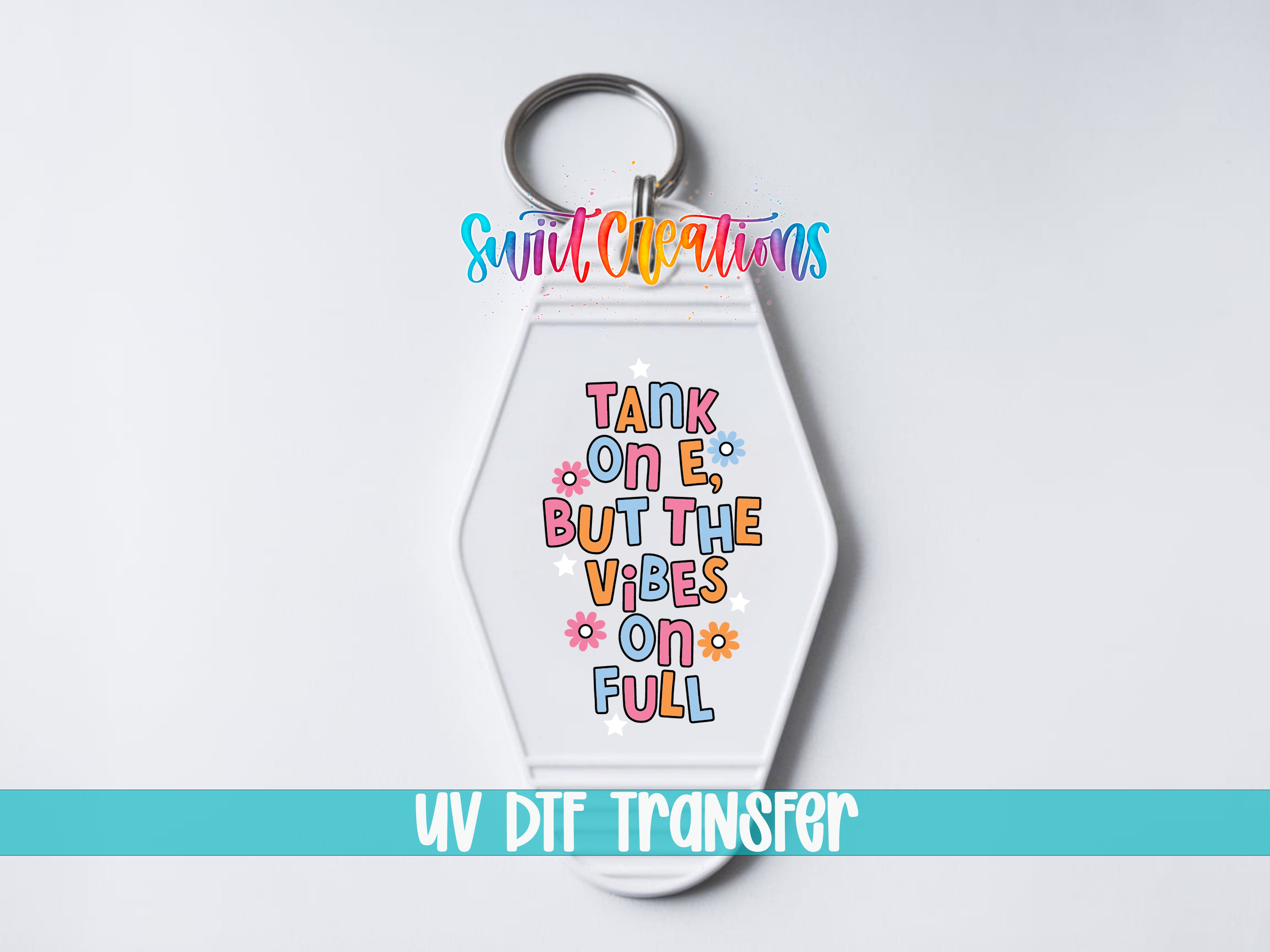 A keychain with a colorful design and text on it.