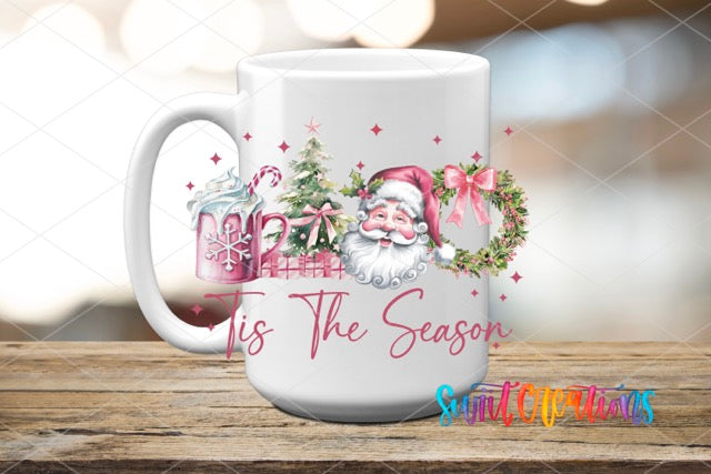 a white coffee mug with a santa clause on it