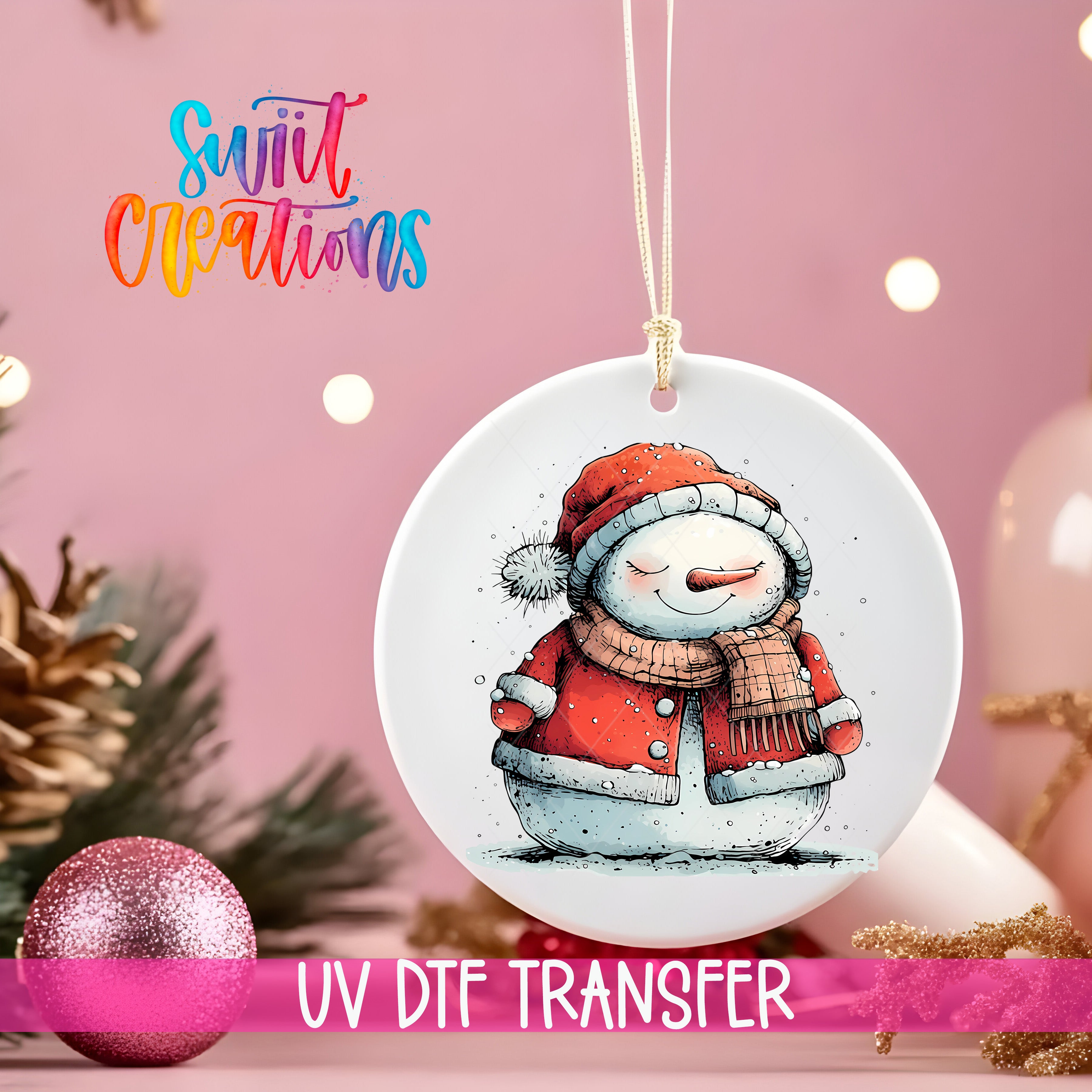 A white ceramic ornament with a snowman illustration is hanging on a string, surrounded by Christmas decorations and a pink background.