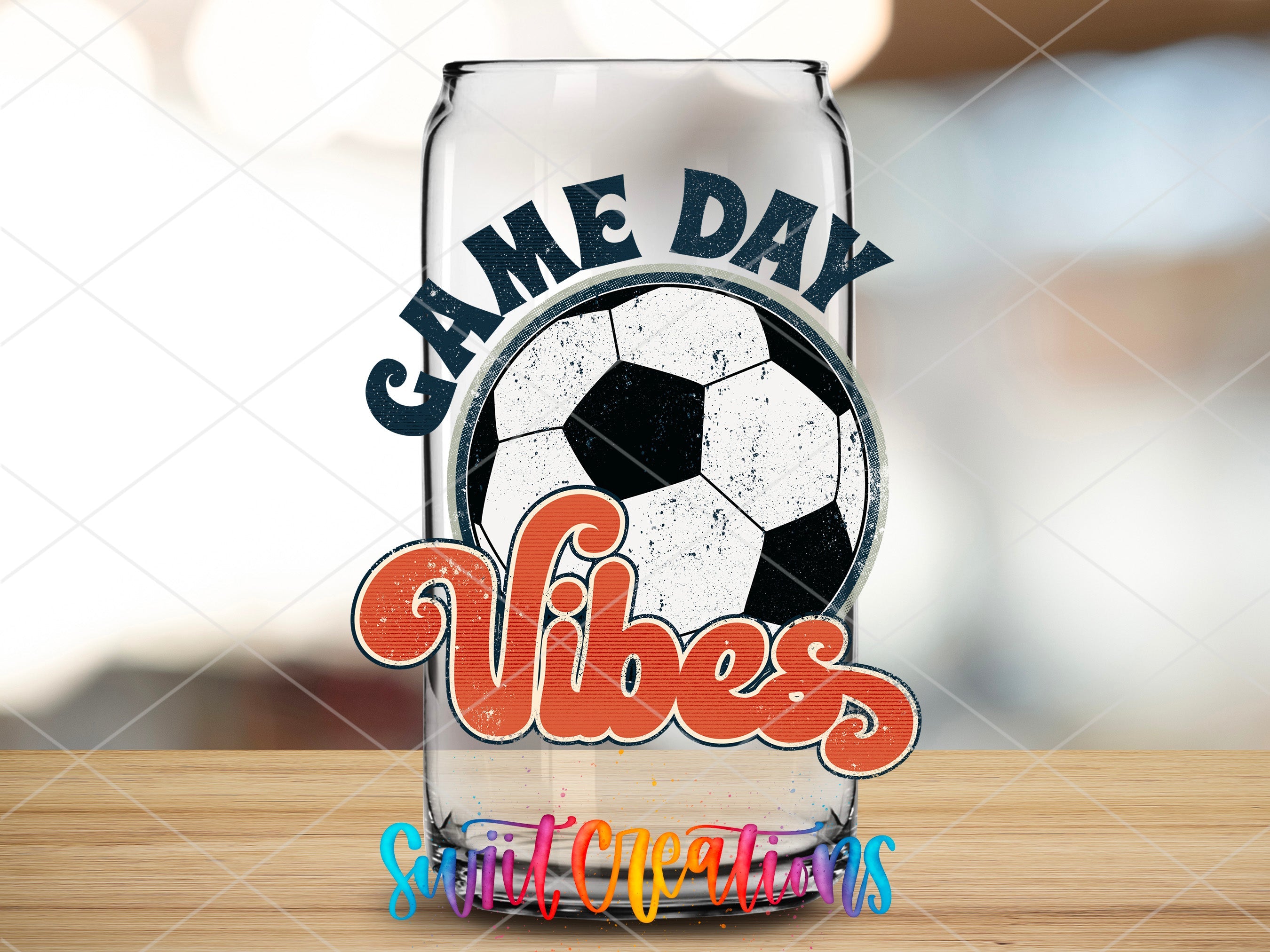 a glass with a soccer ball inside of it