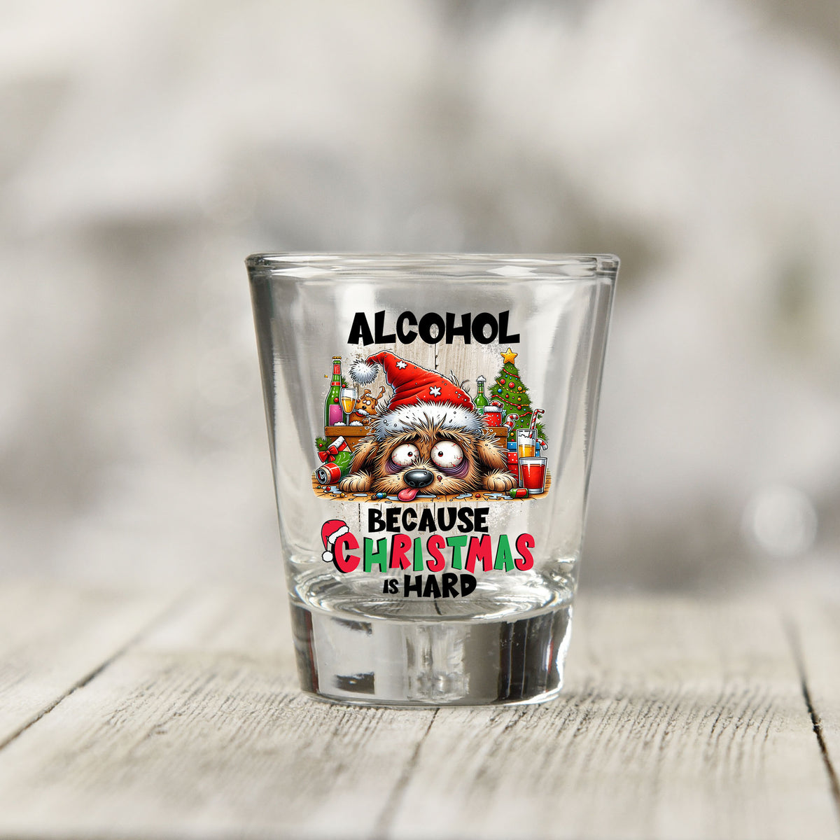 Close-up of the Alcohol Because Christmas is Hard UV DTF transfer on a clear shot glass