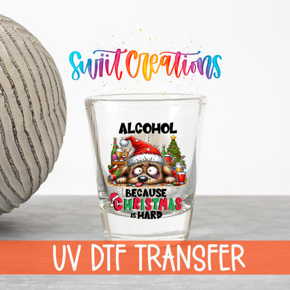 Alcohol Because Christmas is Hard UV DTF transfer on a clear shot glass with the Swiit Creations logo and UV DTF Transfer banner