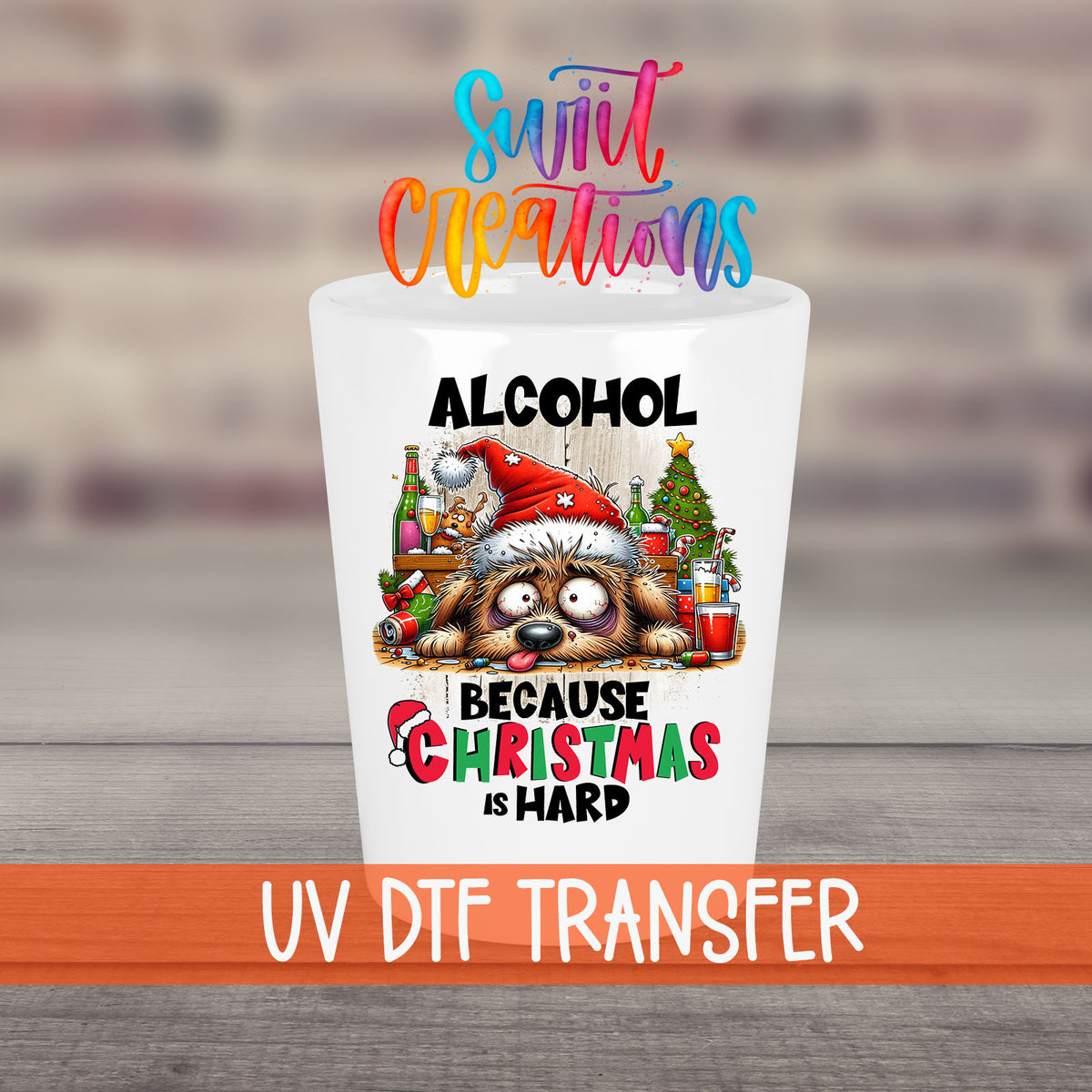 Alcohol Because Christmas is Hard UV DTF transfer on a white shot glass in front of a brick wall