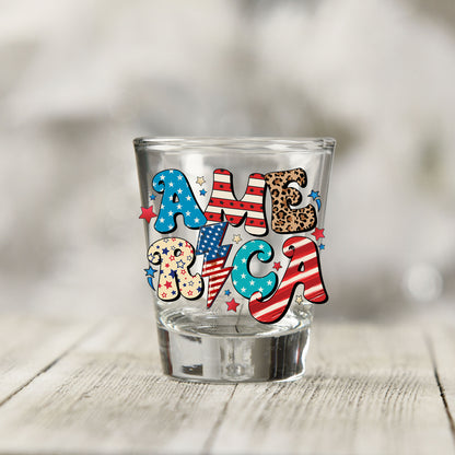 Close-up of the America UV DTF transfer on a clear shot glass