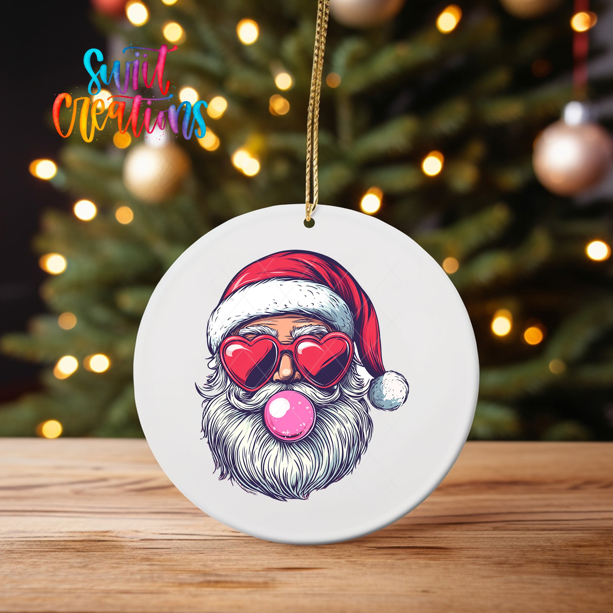 A white ceramic ornament featuring a Santa Claus face with a pink bubble gum bubble in his mouth, wearing sunglasses and a red Santa hat.