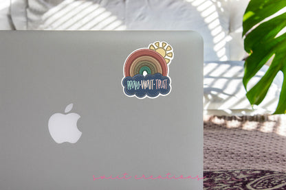 a laptop with a rainbow sticker on it