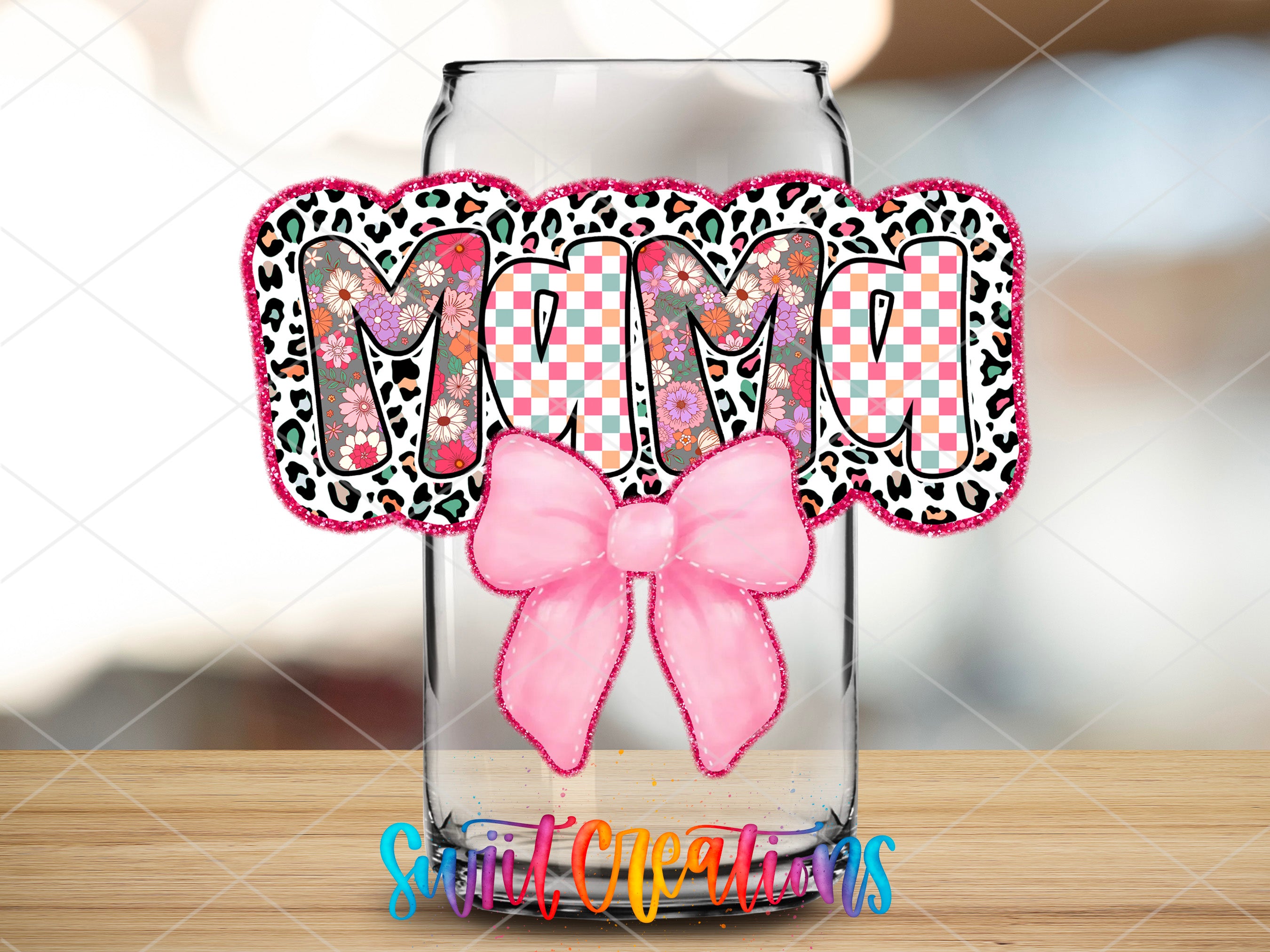 a mason jar with a pink bow on it