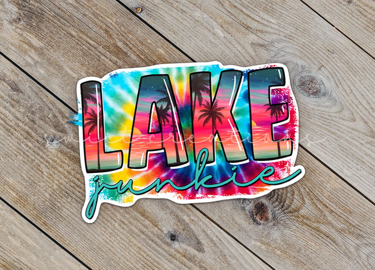 Close-up of the Lake Junkie sticker on rustic wood