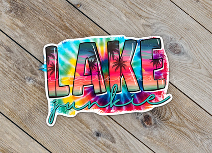 Close-up of the Lake Junkie sticker on rustic wood