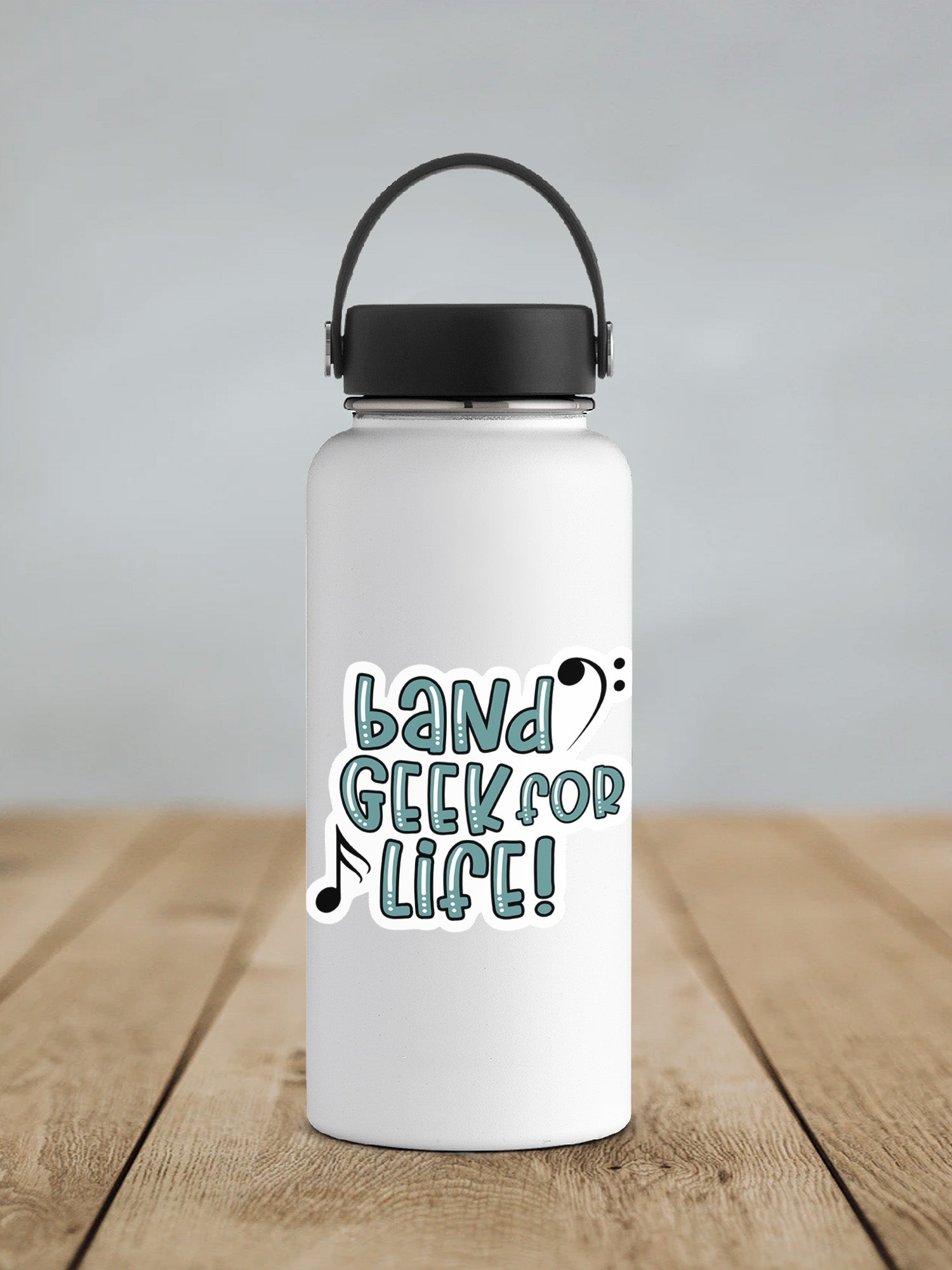 a white water bottle sitting on top of a wooden table