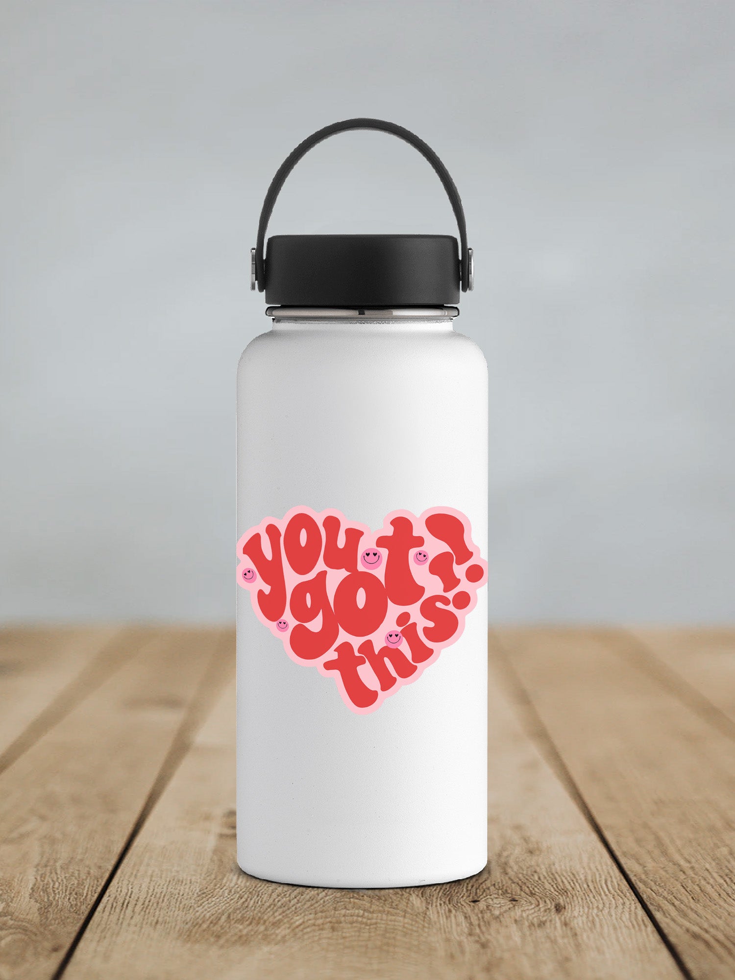 a white water bottle with a red heart on it