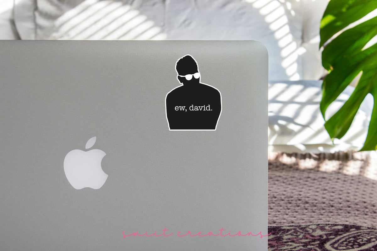 Ew David Silhouette sticker on the lid of a silver laptop
