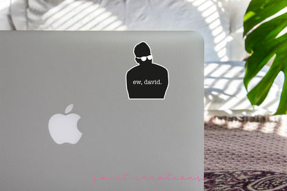 Ew David Silhouette sticker on the lid of a silver laptop