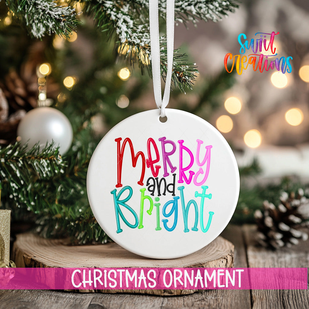 A white Christmas ornament with the text "Merry and Bright" is hanging from a tree branch, surrounded by pine cones and other holiday decorations.
