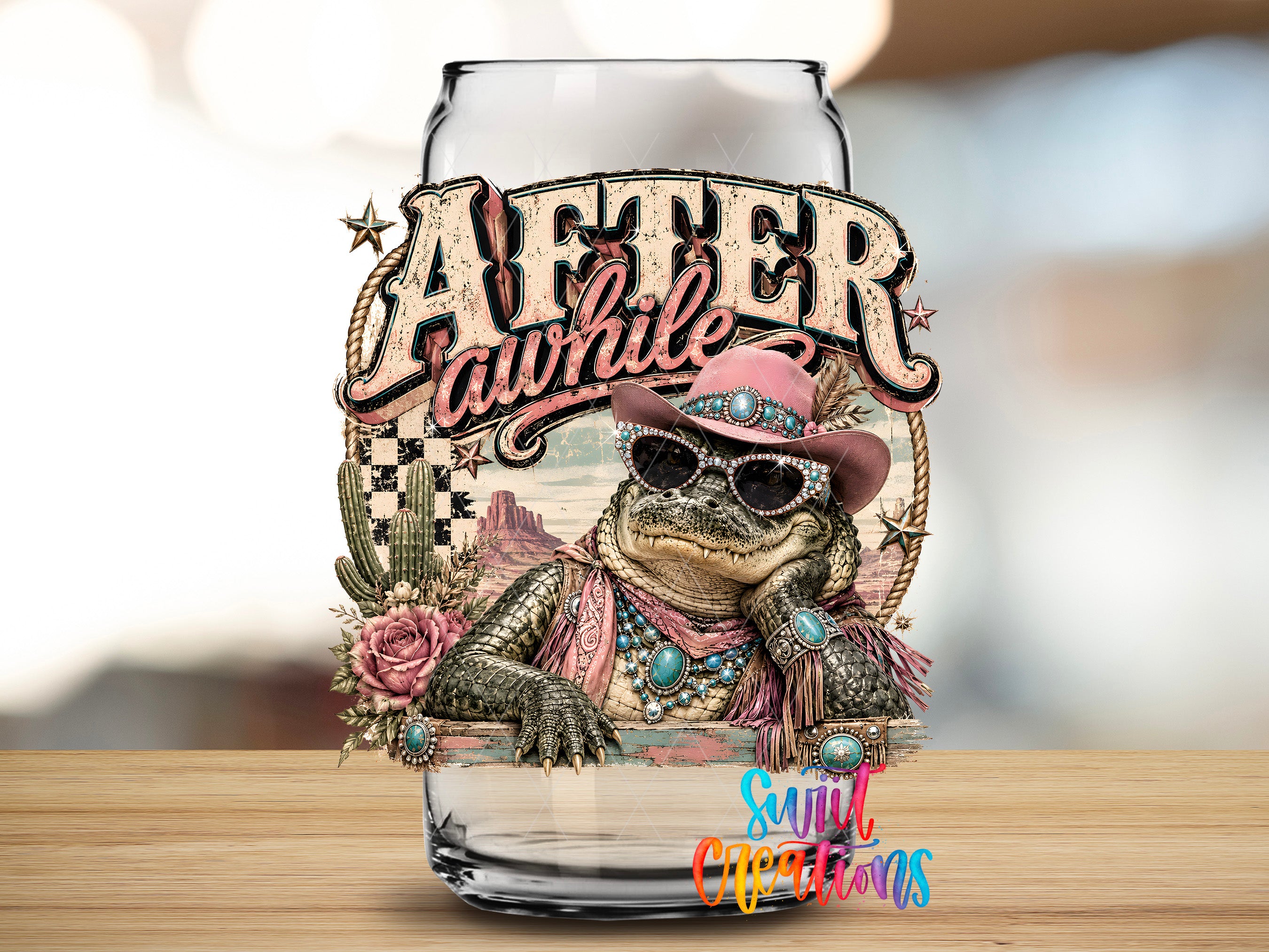 a glass jar with a decorative design, including a cartoon alligator wearing sunglasses and a hat, surrounded by various decorative elements such as flowers and cacti.