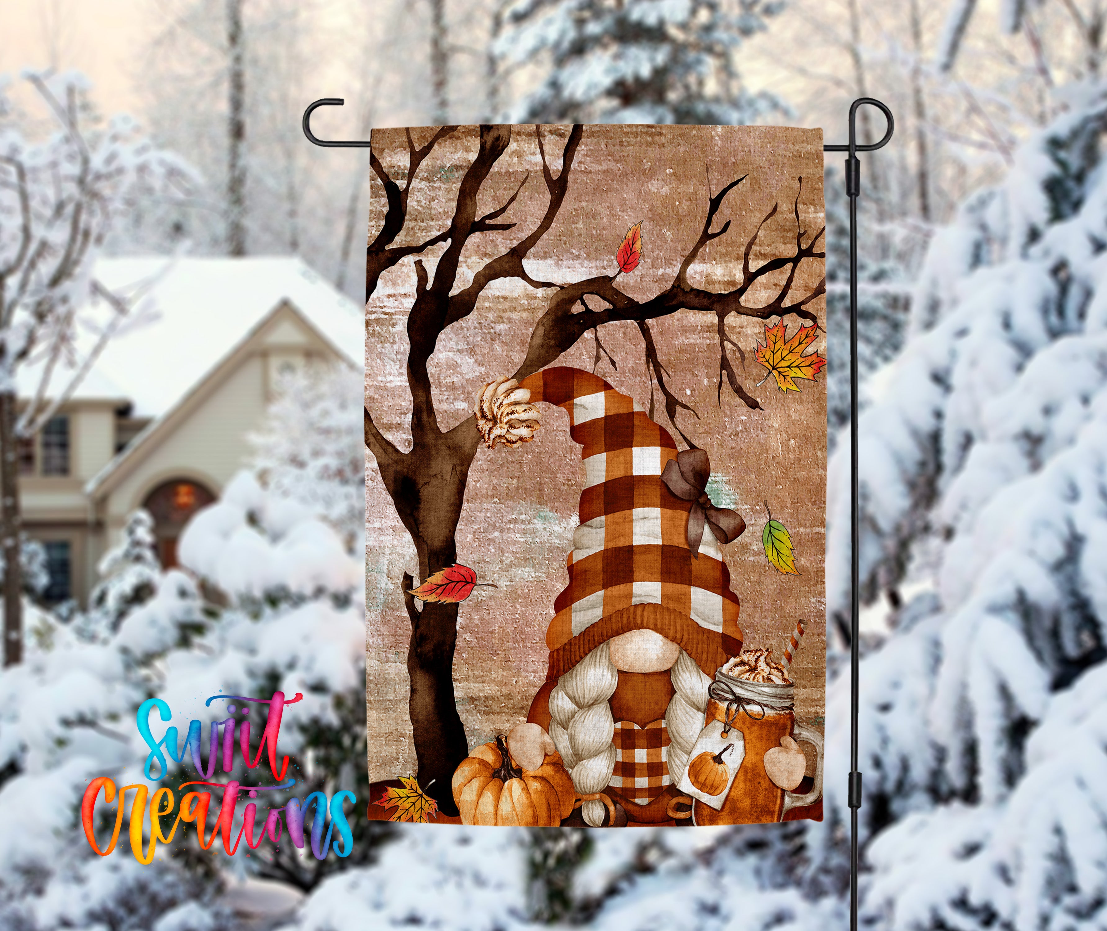 A colorful autumn-themed garden gnome is depicted in a snowy landscape, with a house and trees in the background.