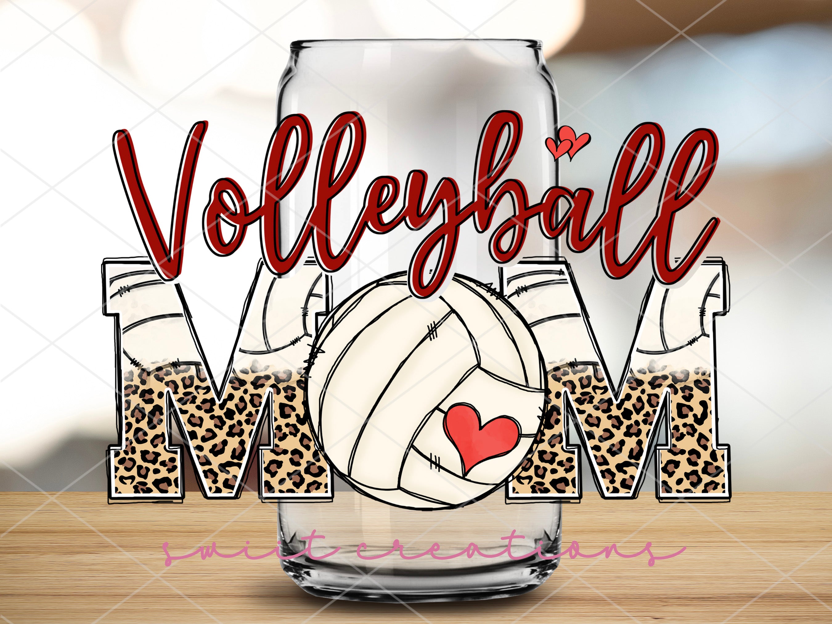 a glass with a volleyball mom on it