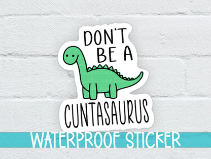 Don't Be a C*ntasaurus sticker on a white brick background with a waterproof sticker banner