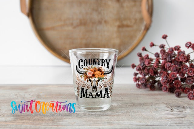 a shot glass sitting on top of a wooden table