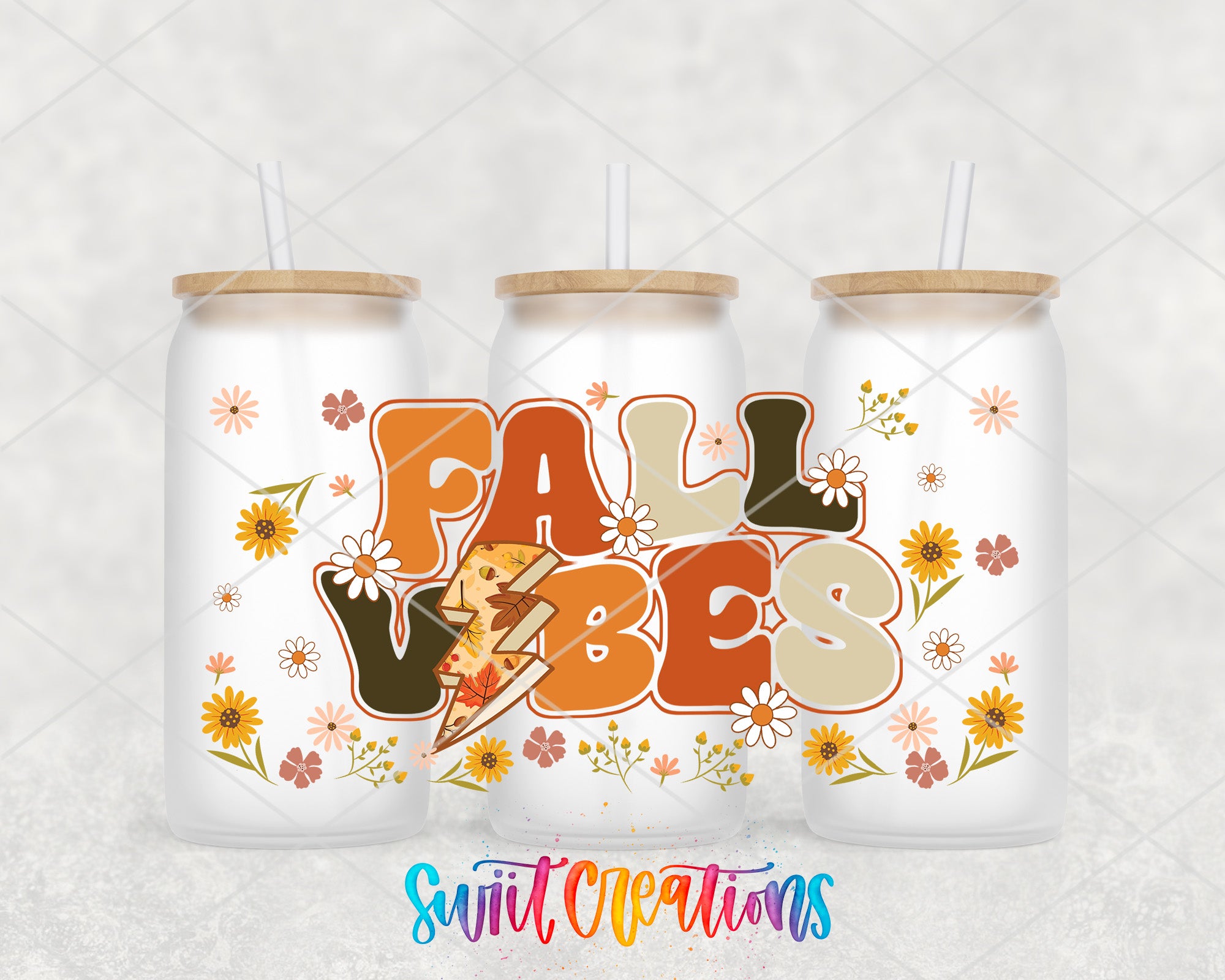 three glass tumblers with a colorful design and the text "FALL VIBES" printed on them.