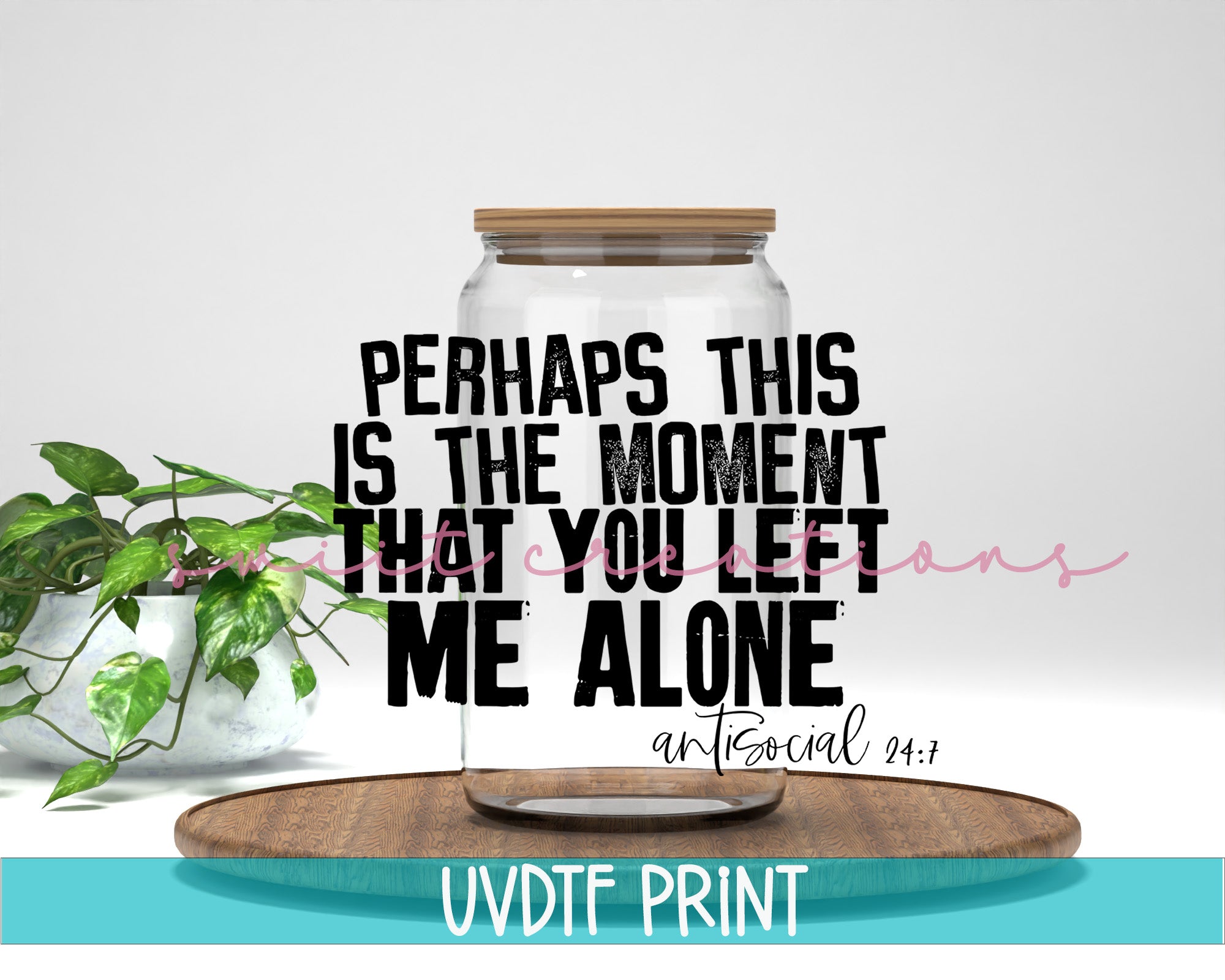 a jar with a plant in it sitting on top of a table
