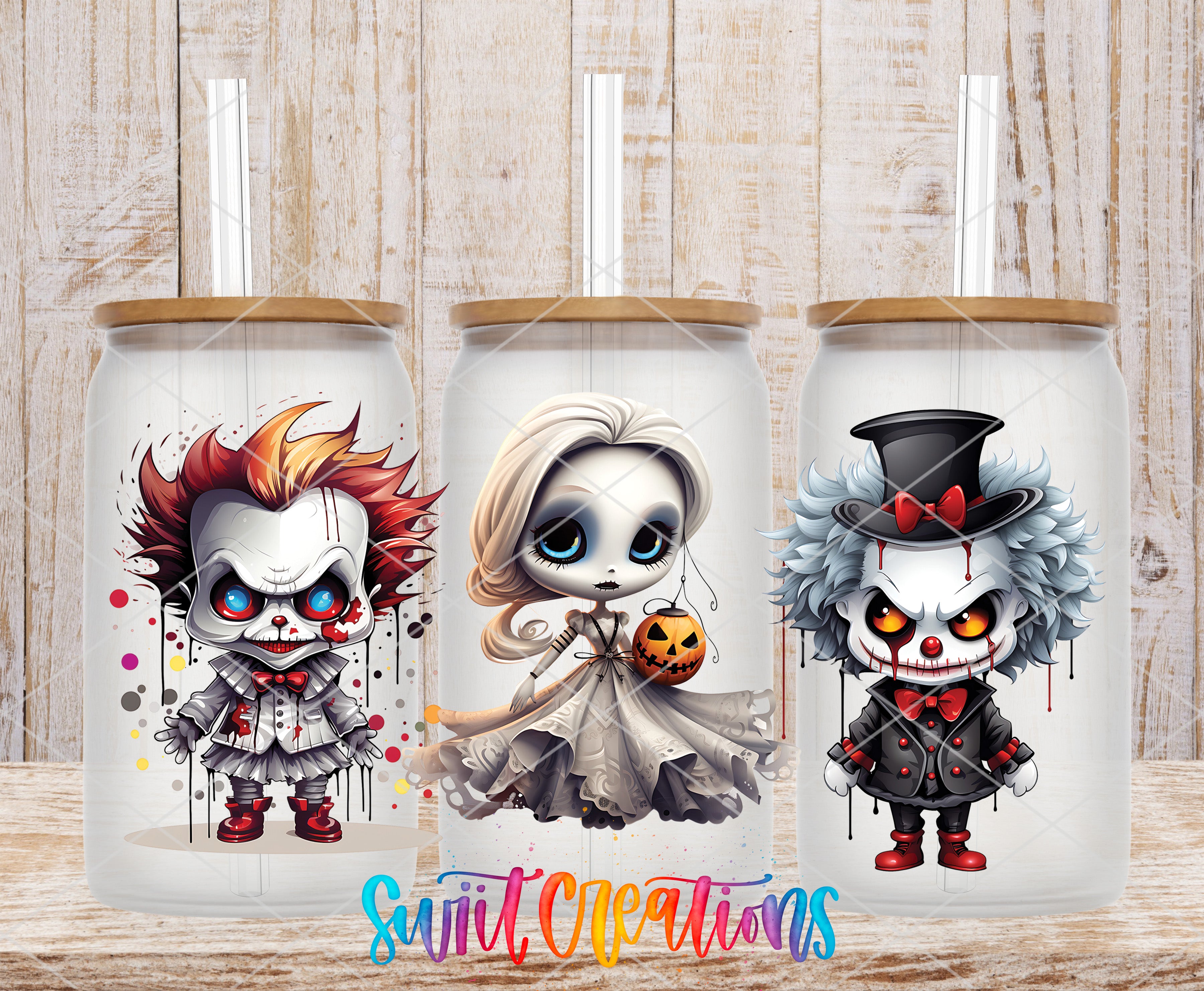 three glass tumblers with Halloween-themed illustrations on them.