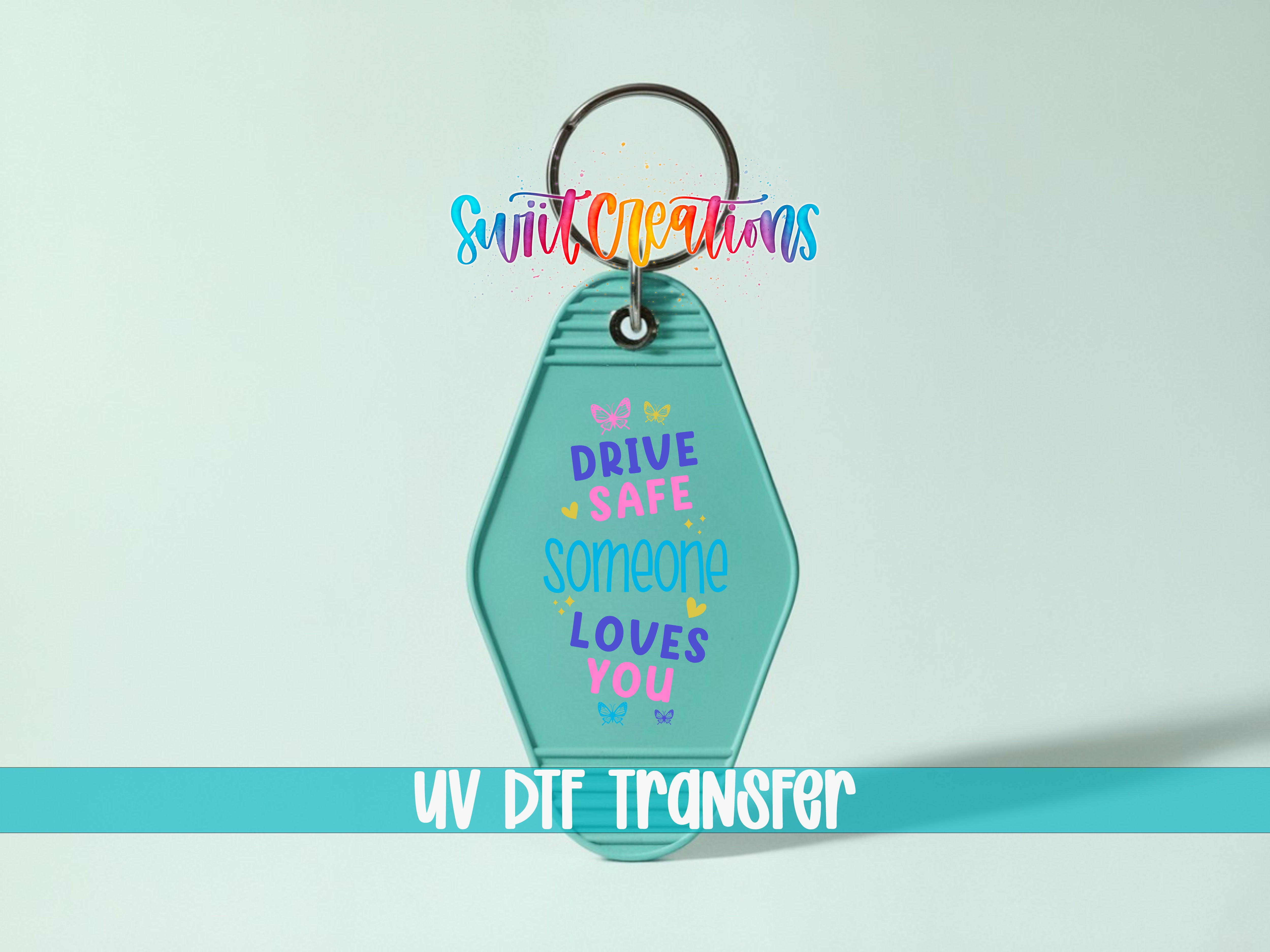 A keychain with a message that says "DRIVE SAFE SOMEONE LOVES YOU" in a colorful, artistic font.