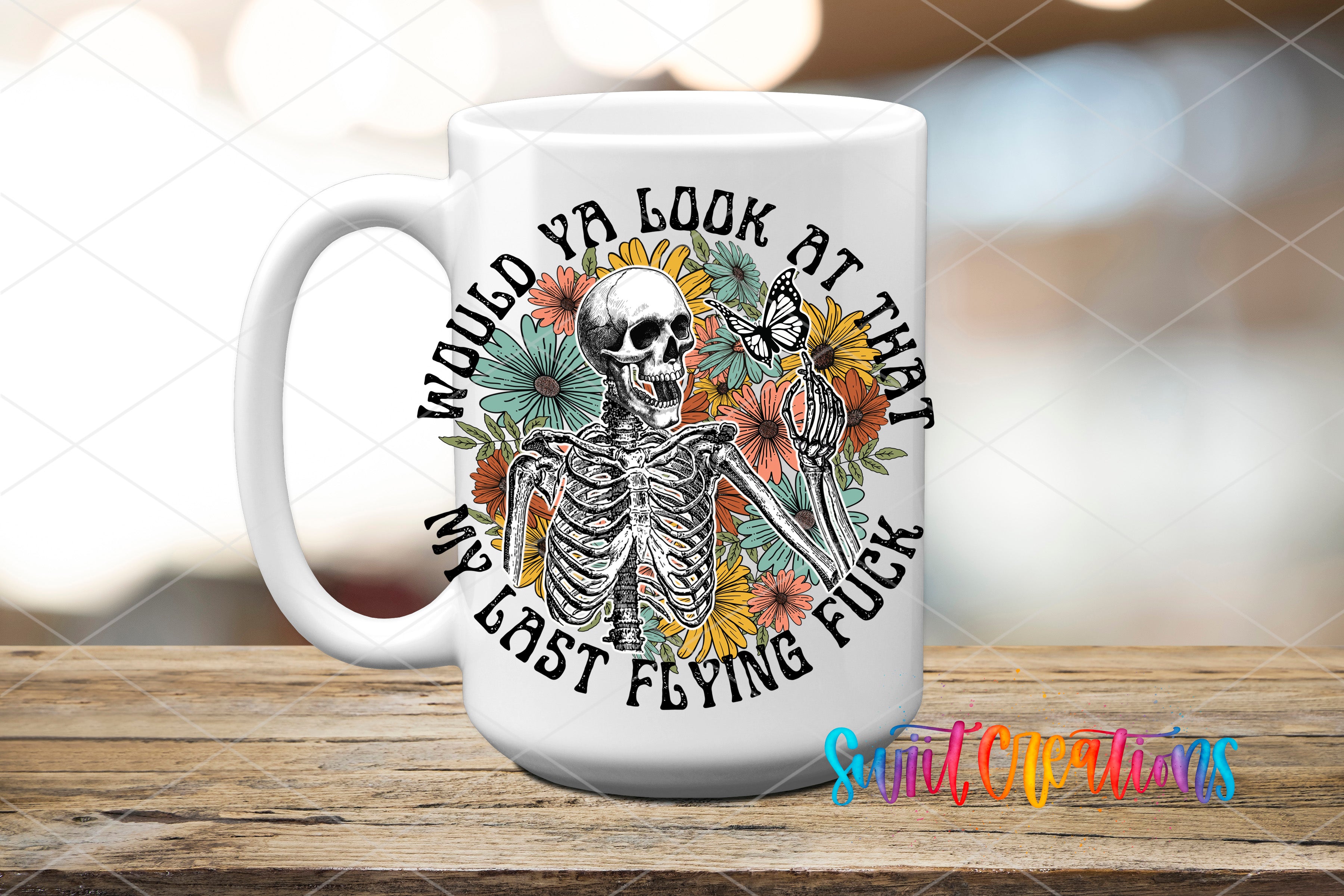 A white ceramic mug with a graphic design featuring a skeleton holding a butterfly and surrounded by flowers.