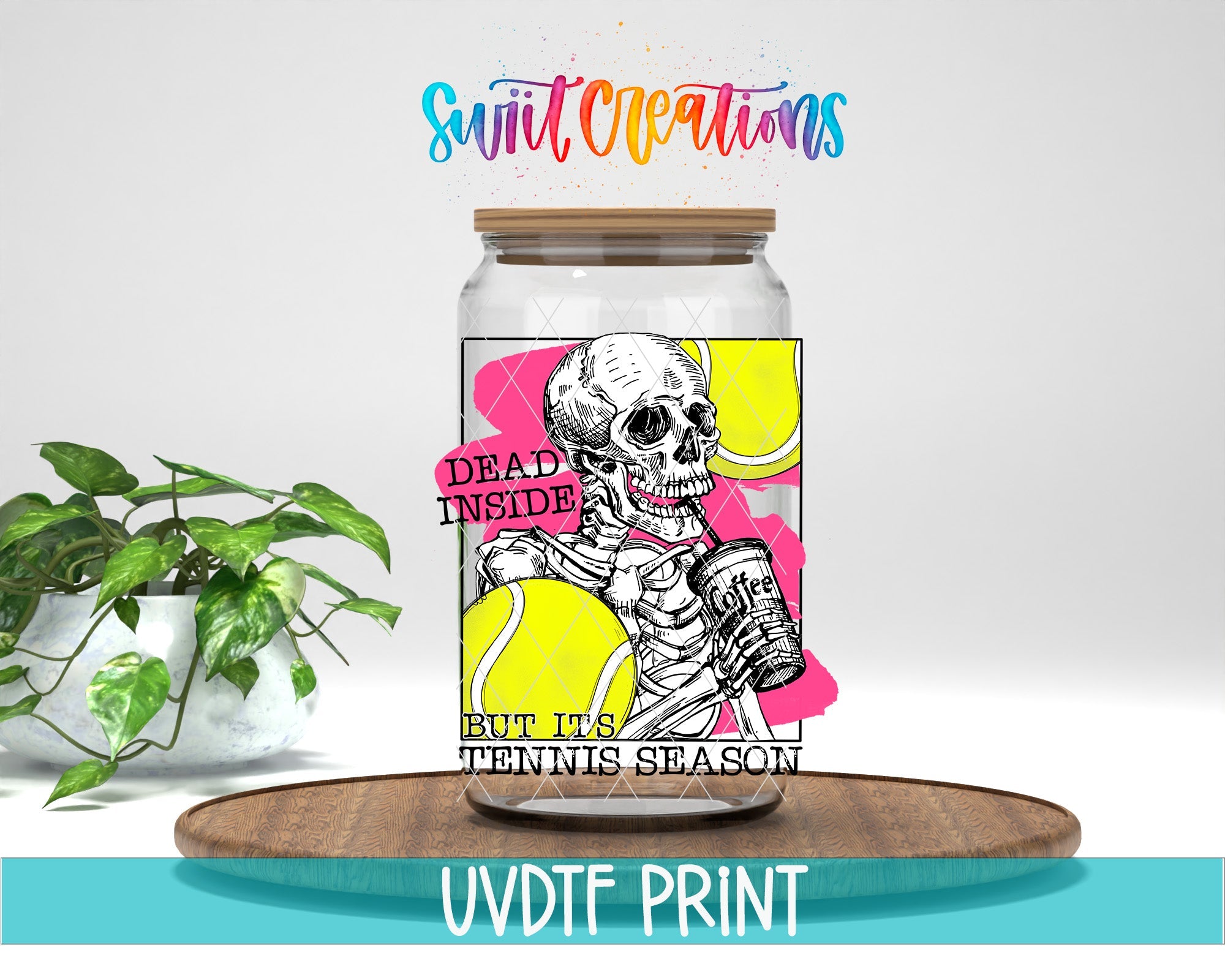 a jar with a skeleton in it sitting next to a potted plant
