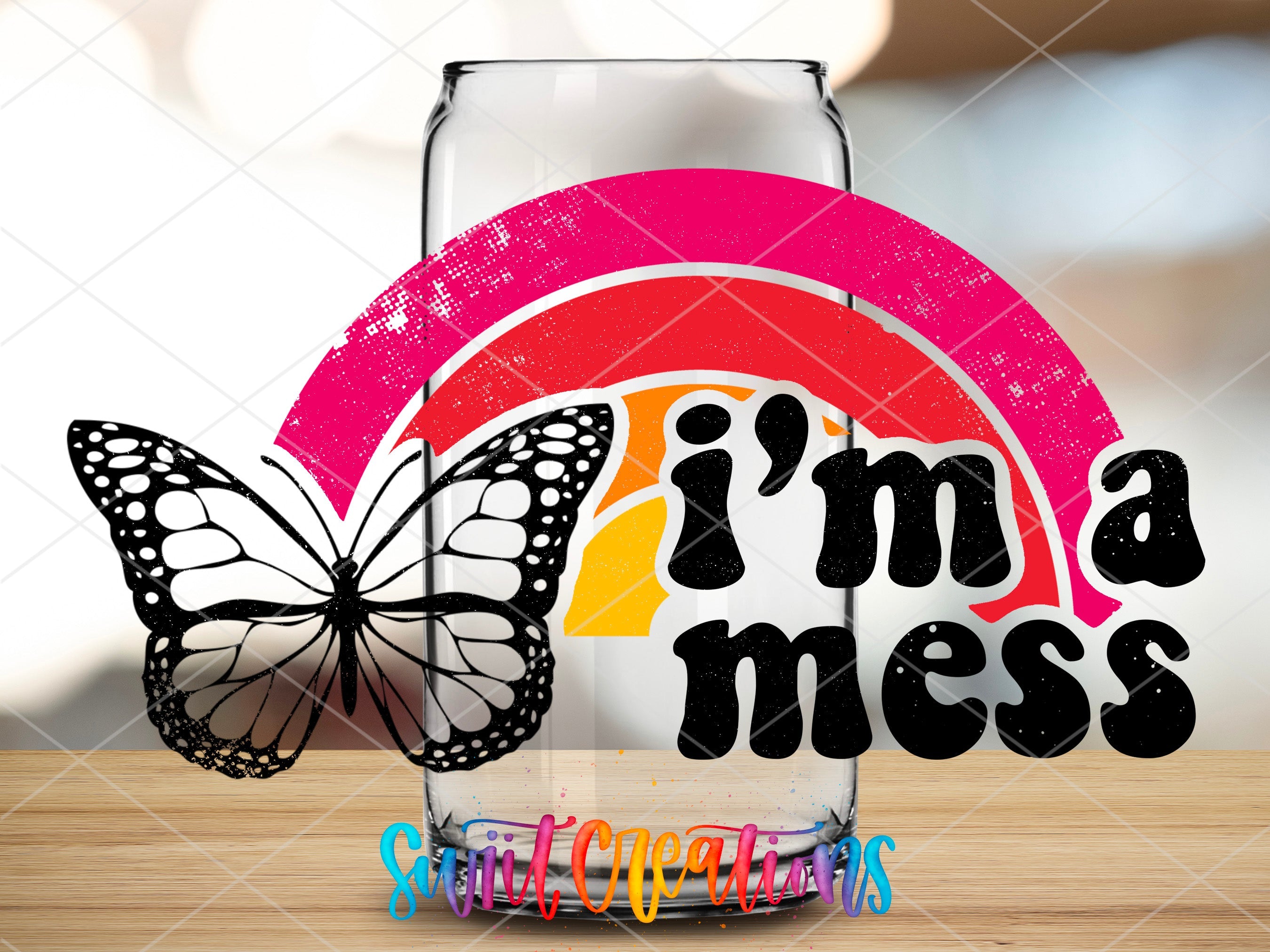 a glass with a butterfly sitting on top of it