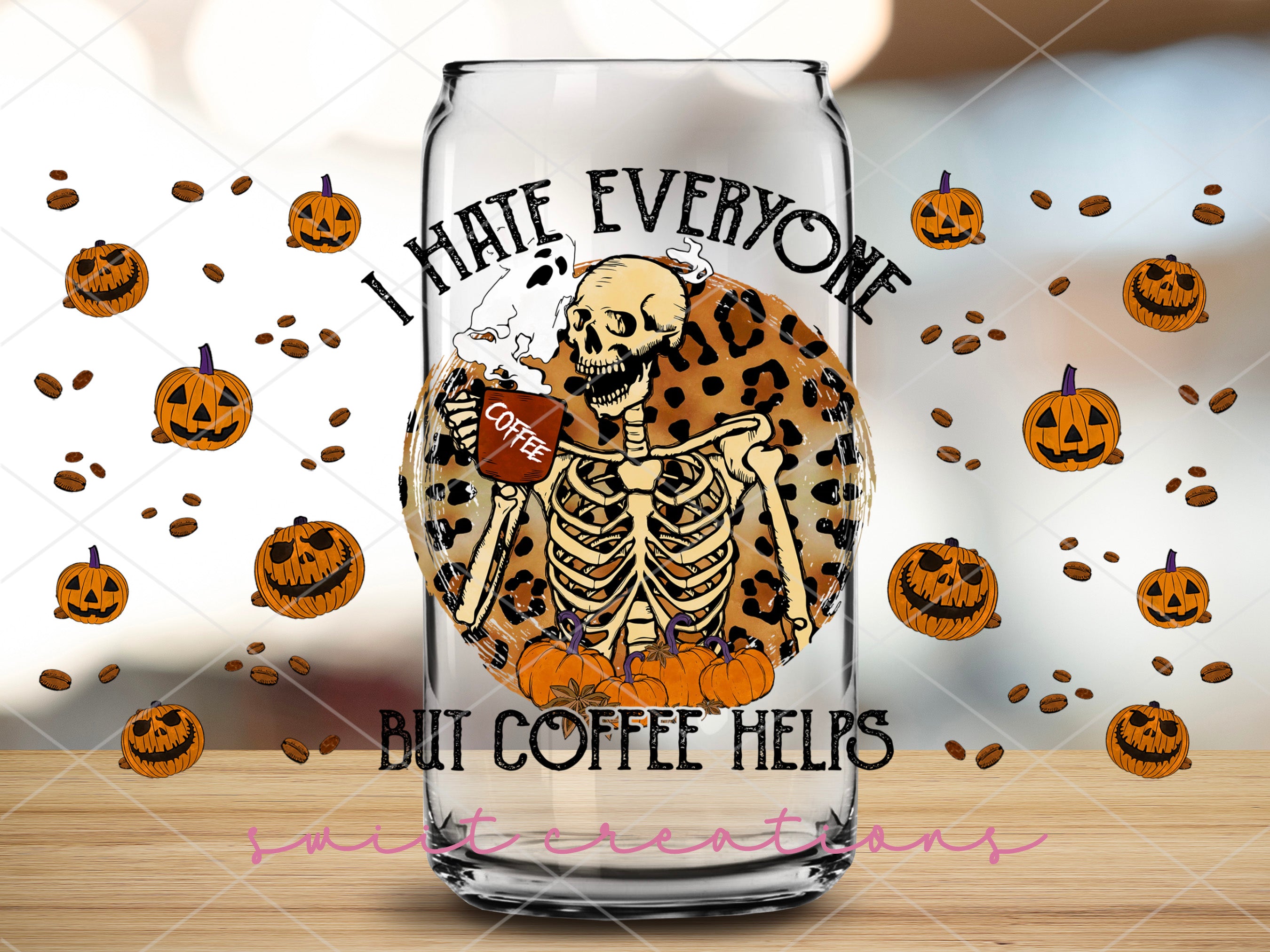a glass with a picture of a skeleton holding a football