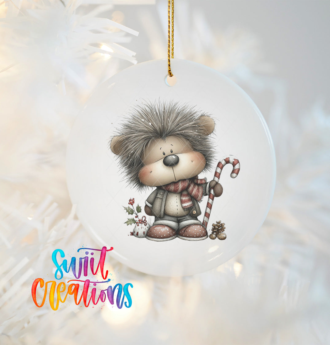 A ceramic ornament featuring a cartoon hedgehog character with a scarf and candy cane, hanging on a Christmas tree.