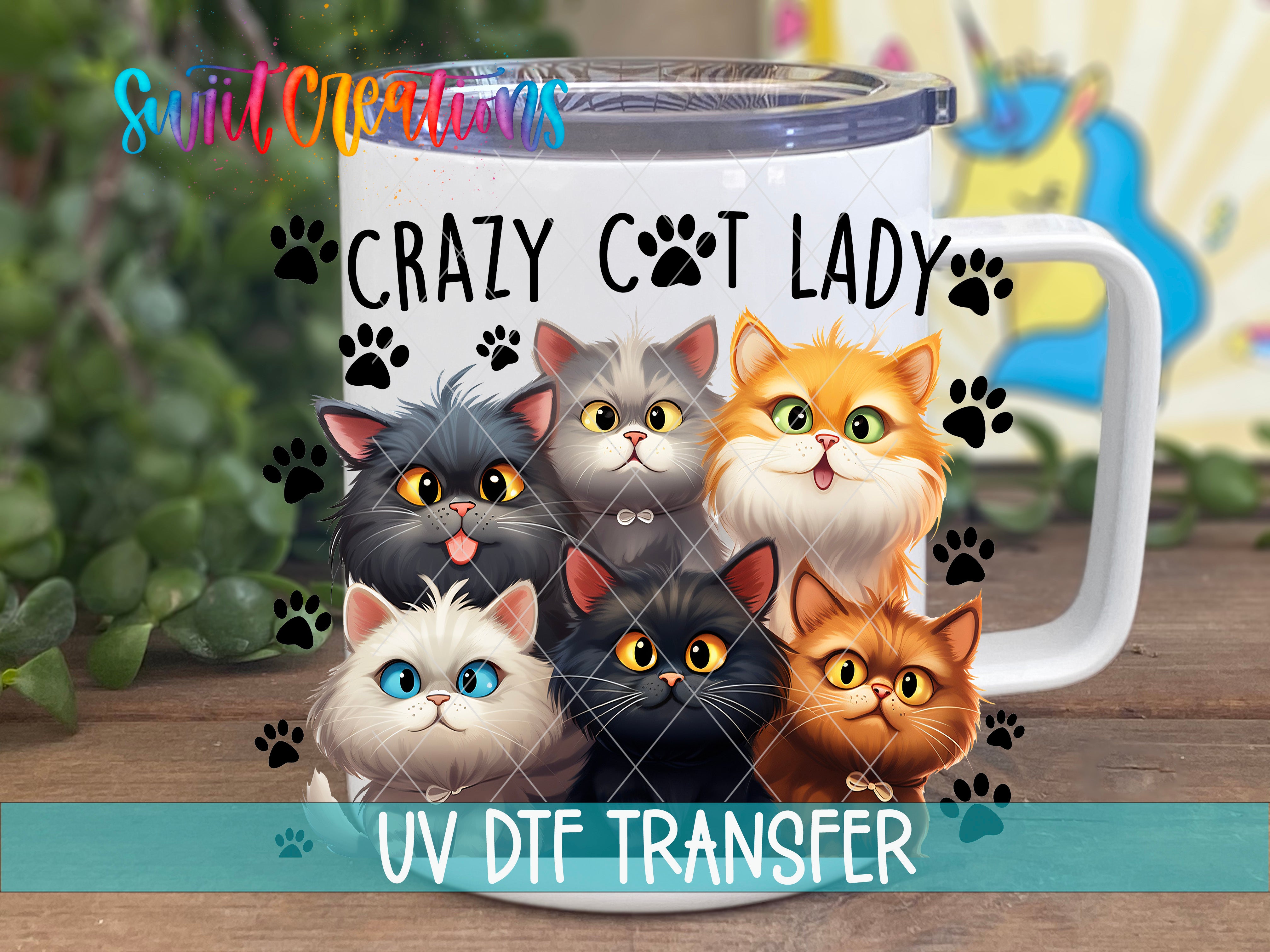 A mug with a cartoon image of six cats, each with a unique color and expression, surrounded by paw prints. The mug is labeled "Crazy Cat Lady" and "UV Dtf Transfer".