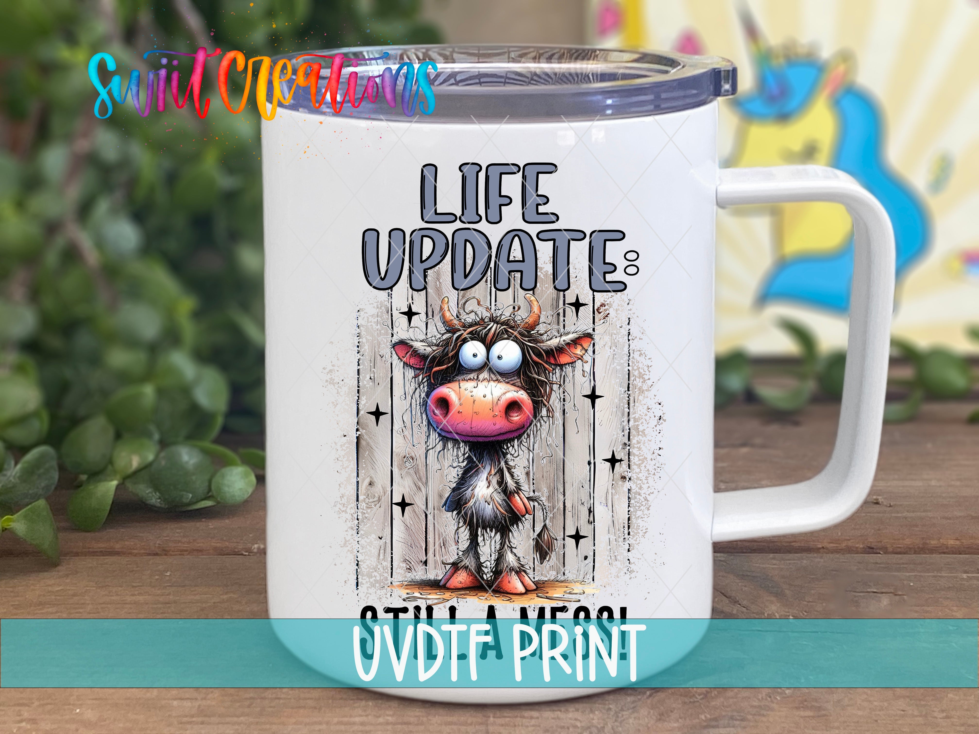 a white coffee mug with a cartoon cow on it