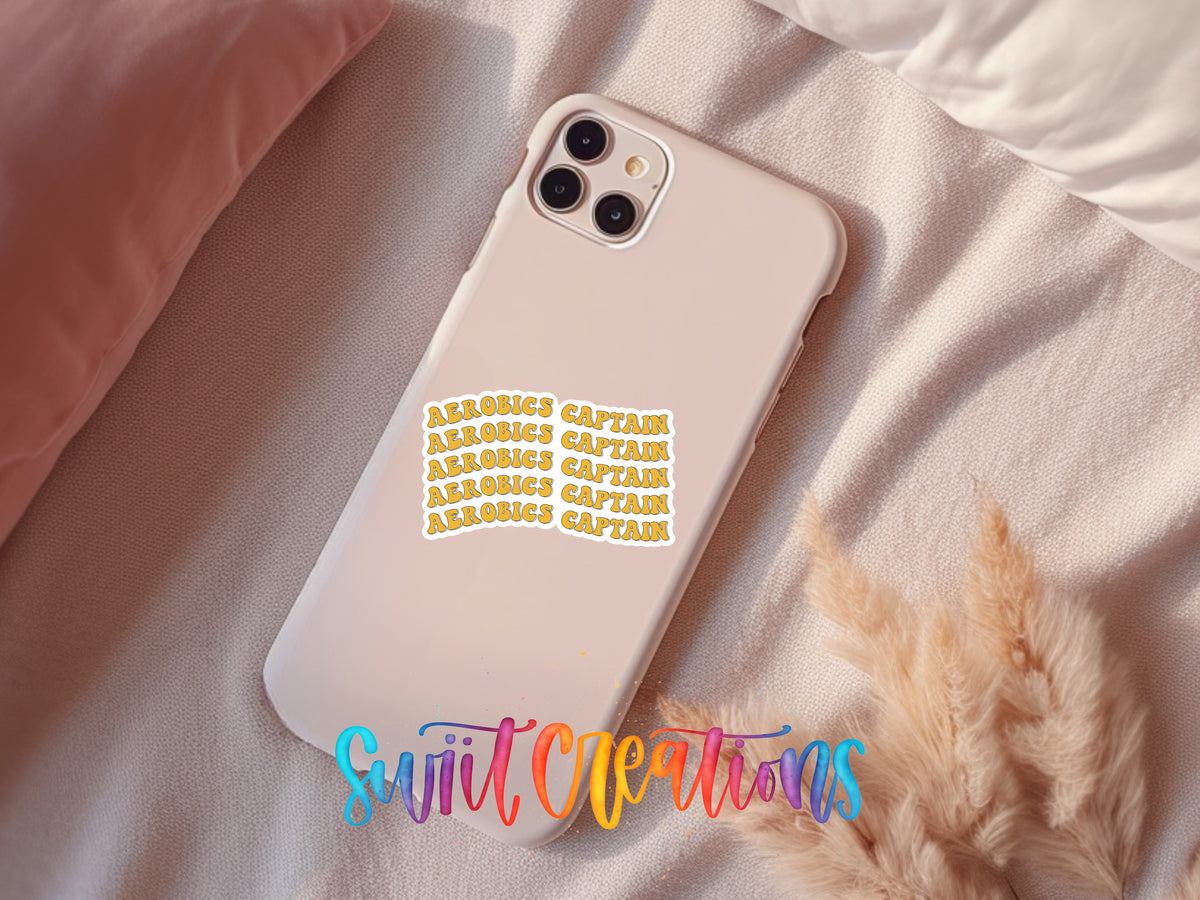 A white smartphone case with a sticker on it, placed on a bed with a pink pillow.