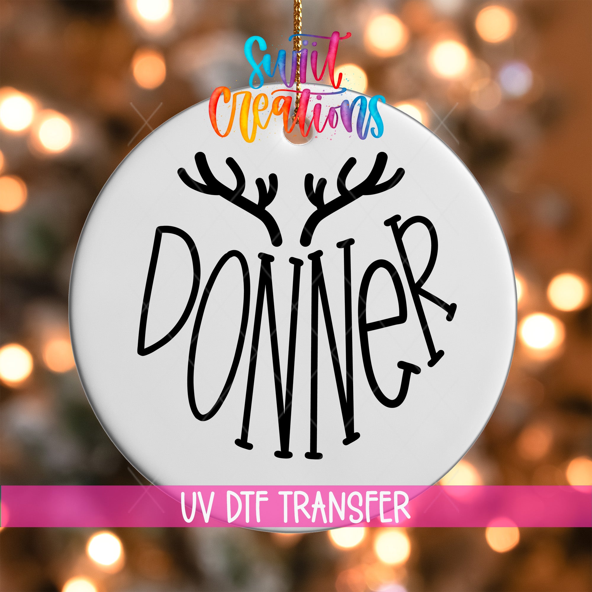 A white ornament with the word "DONNER" written on it, hanging against a background of colorful lights.