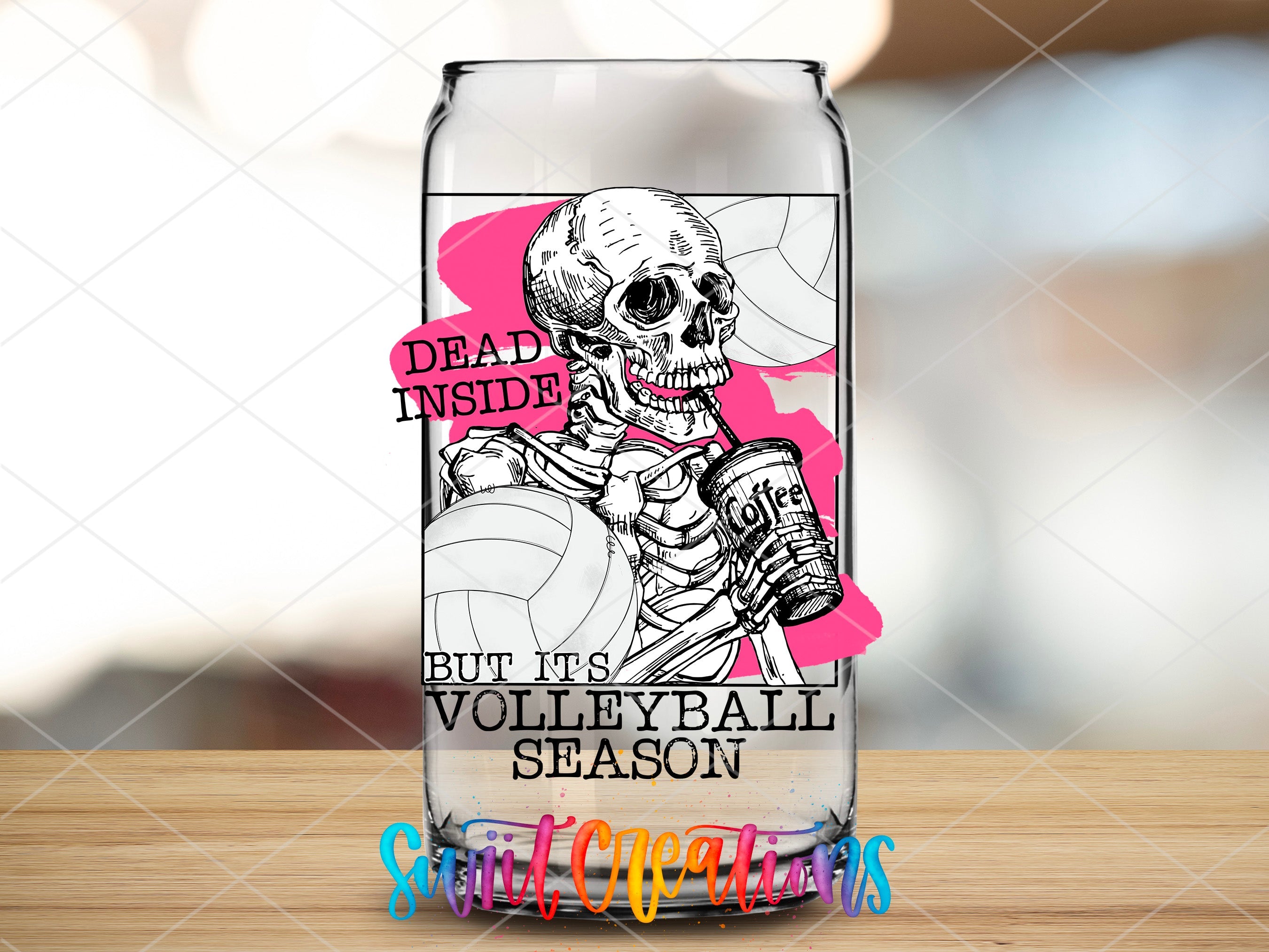 a glass with a skeleton holding a volleyball ball