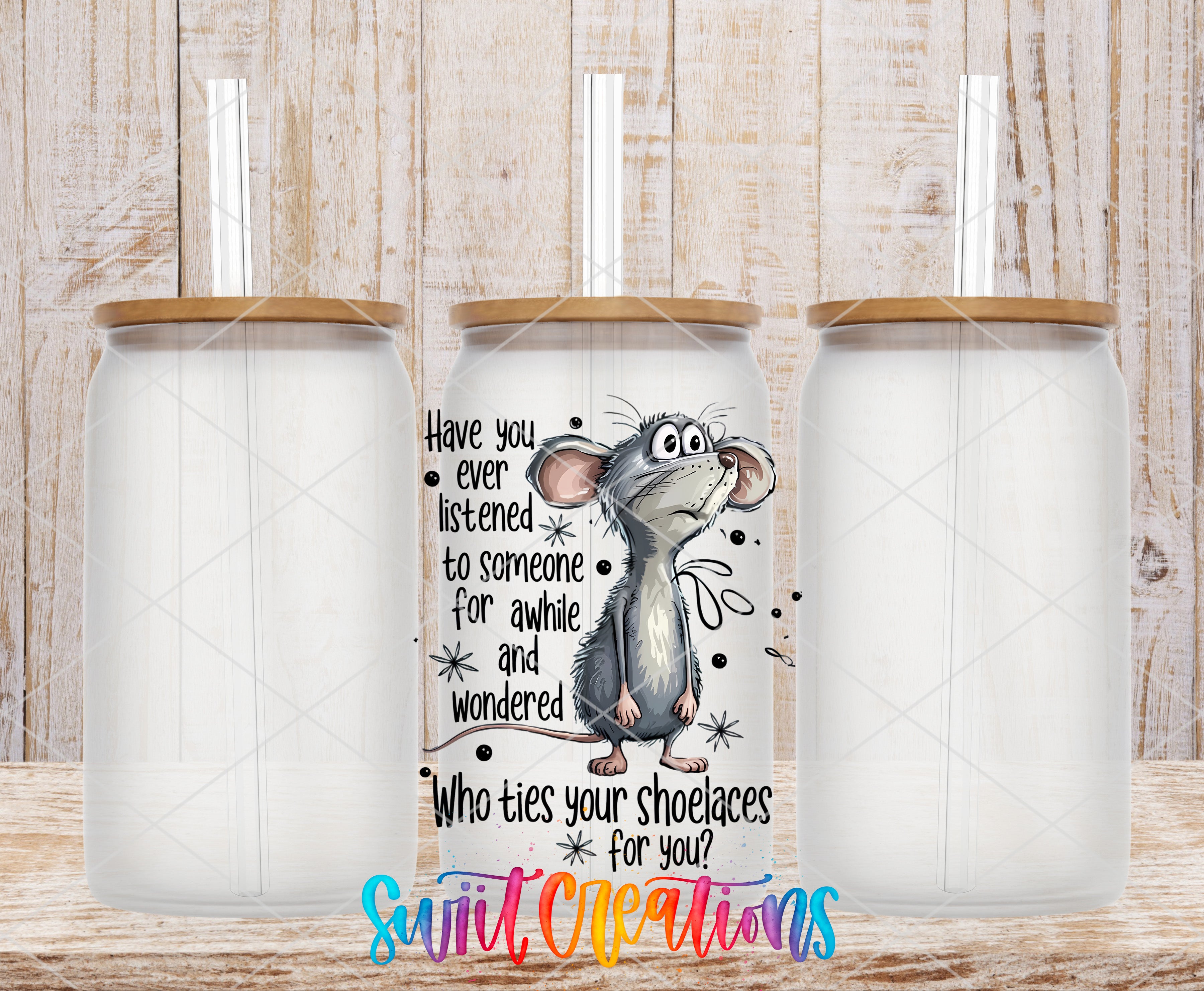 a clear glass tumbler with a printed design of a cartoon mouse and a humorous text overlay.