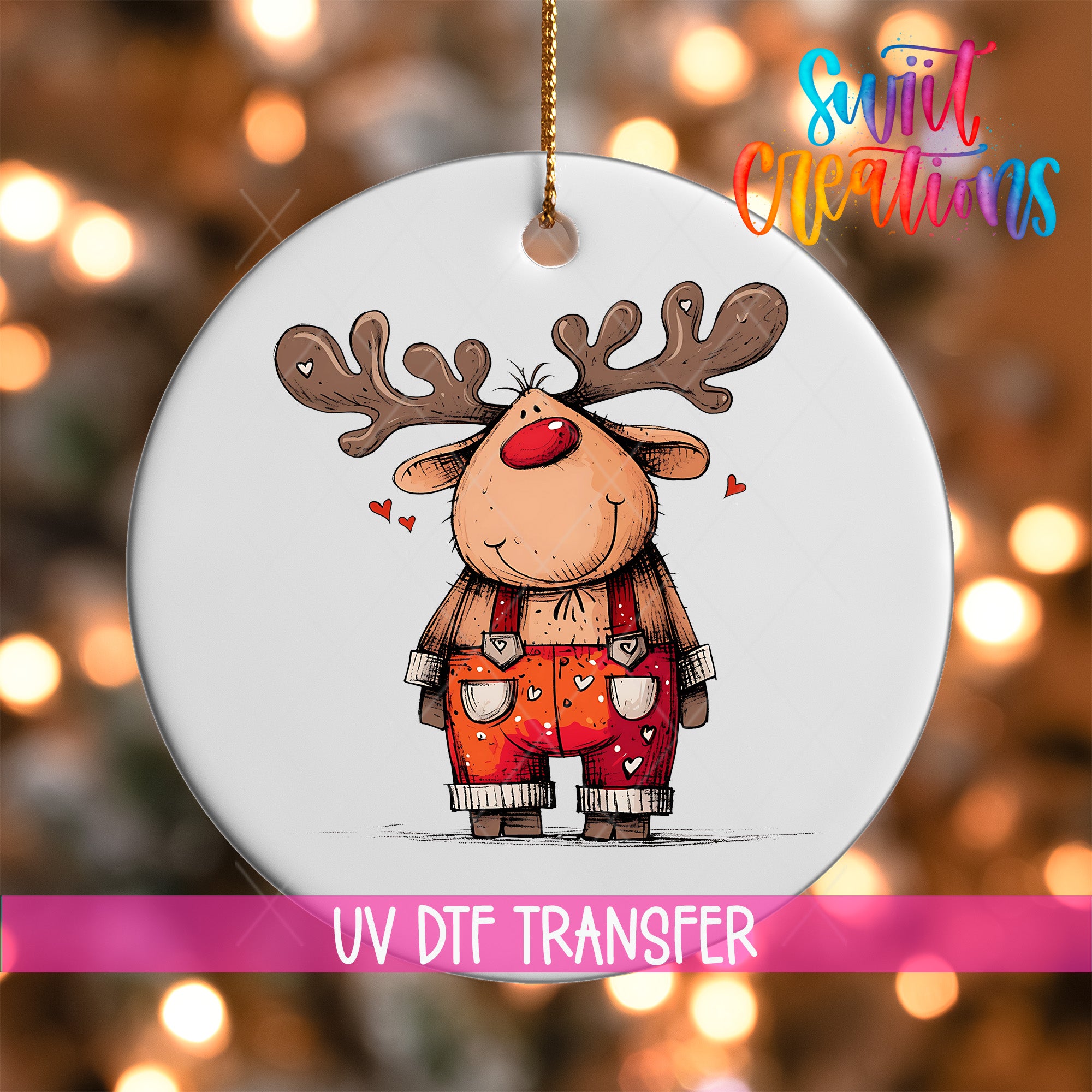A white ornament featuring a cartoon reindeer with antlers and a red nose, set against a blurred background with colorful lights.