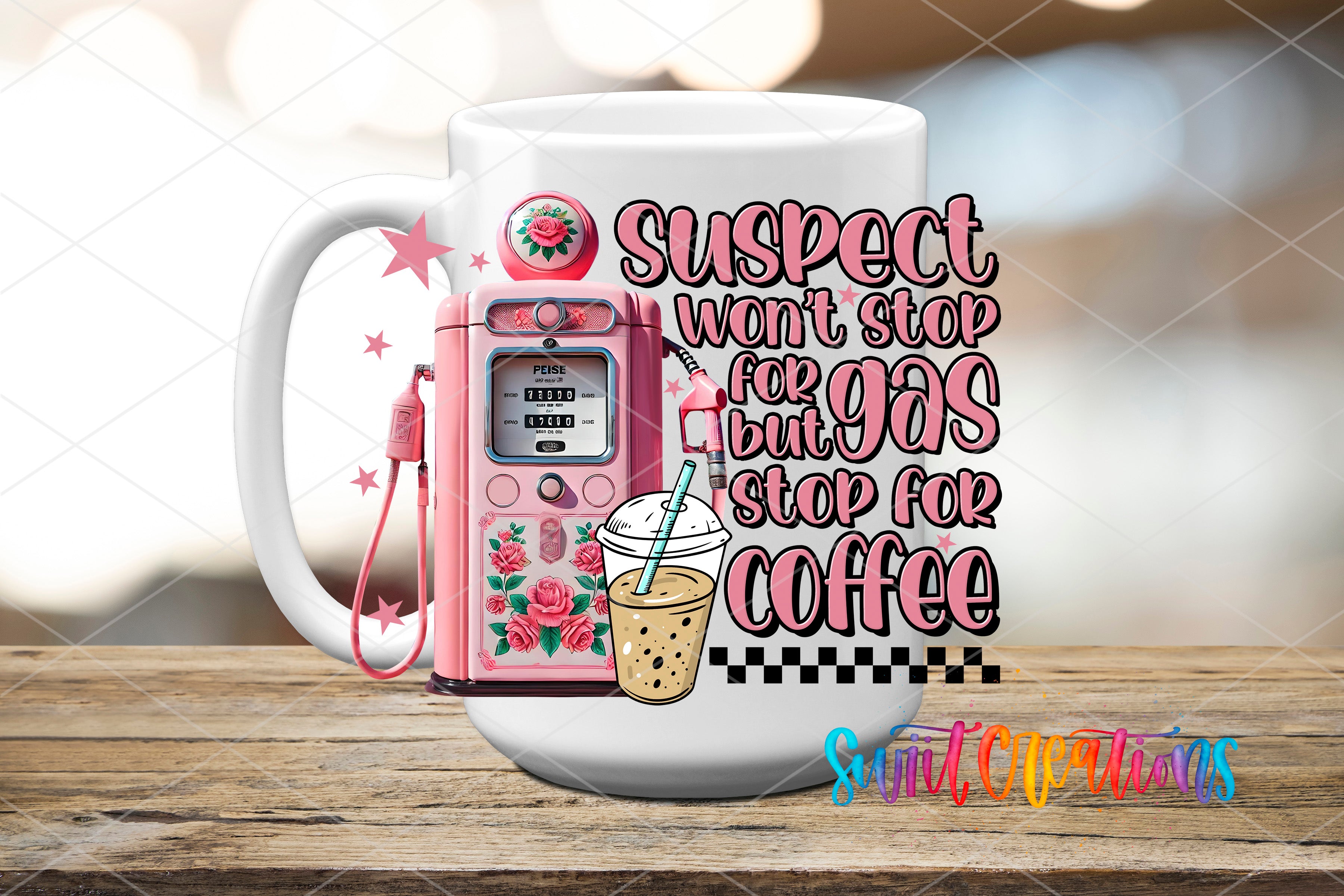 a coffee mug with a pink phone on top of it
