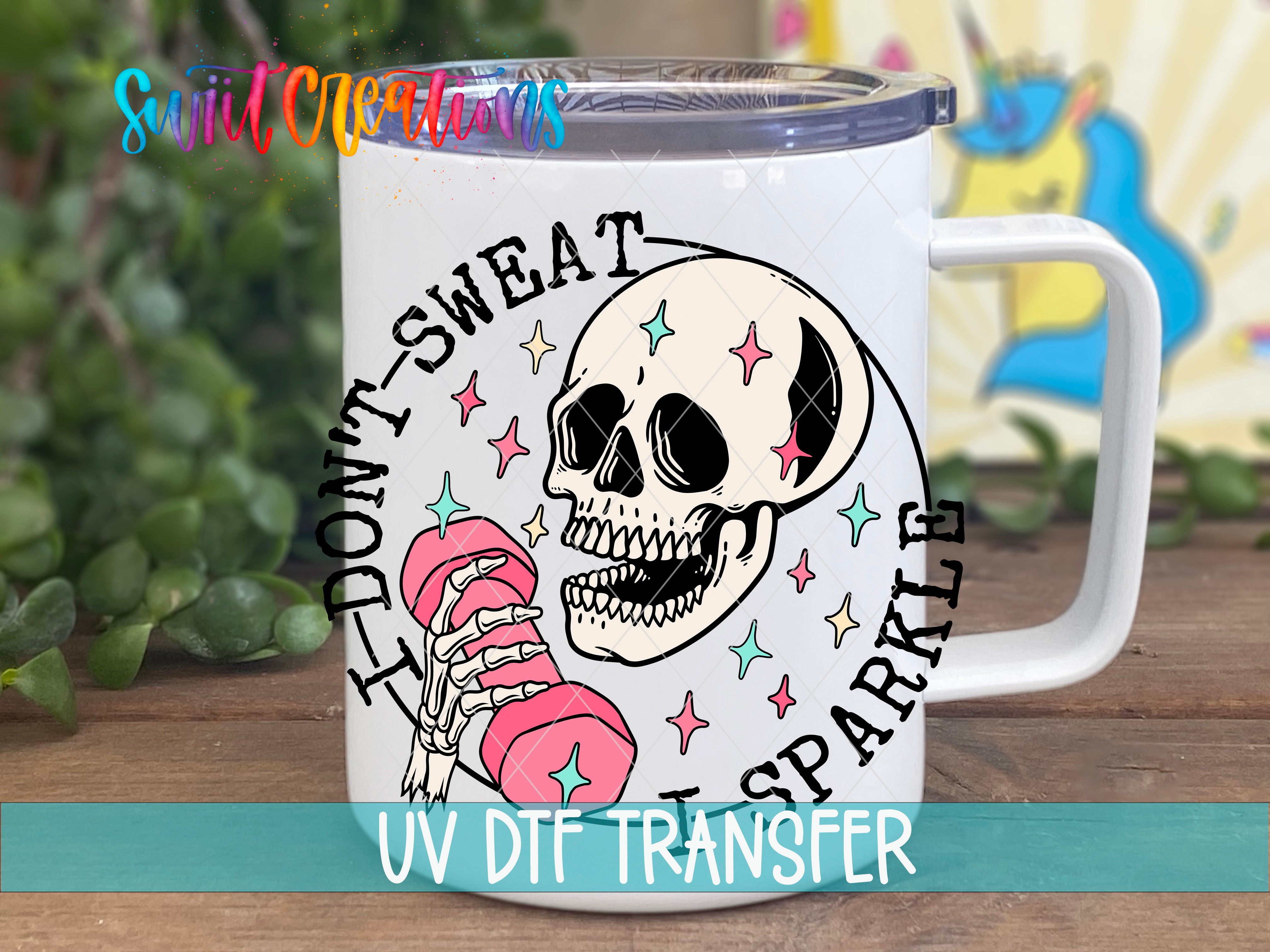A white mug with a skull design and the text "I DON'T SWEAT SPARKLE" printed on it.