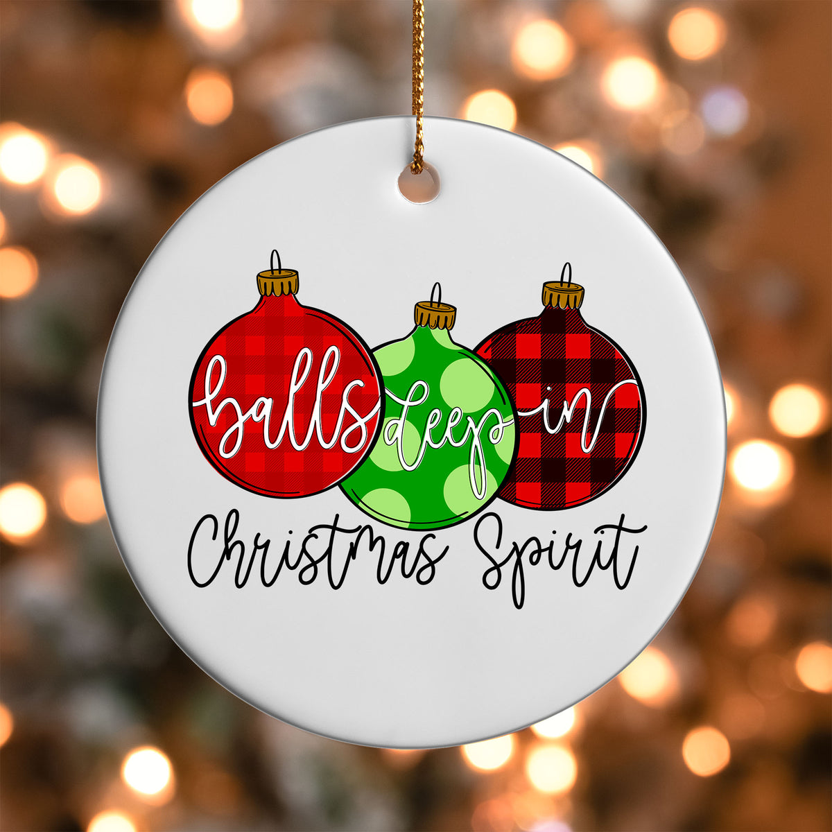 Balls Deep in Christmas Spirit ornament UV DTF transfer on a round white ornament with a bokeh light background