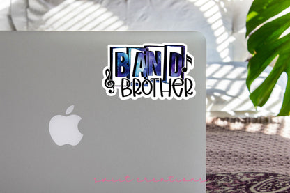Blue Band Brother sticker on the lid of a silver laptop