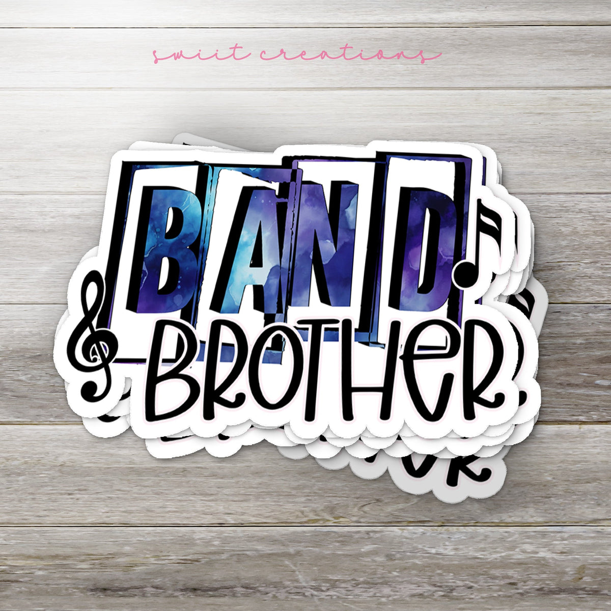 Stack of Blue Band Brother glossy stickers on a gray wood table