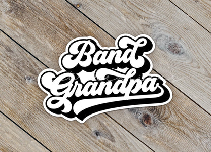 Close-up of the Retro Band Grandpa sticker on rustic wood