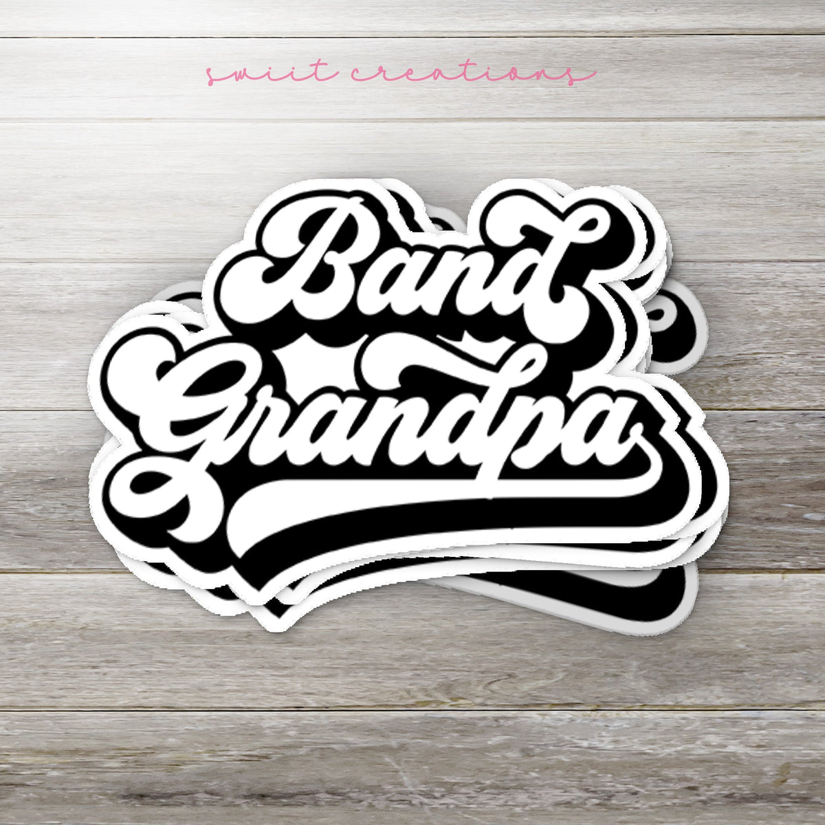 Stack of Retro Band Grandpa glossy stickers on a gray wood table